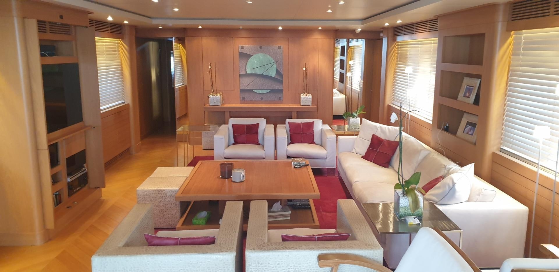 a living room with a table and chairs aboard TIGRA Yacht for Sale