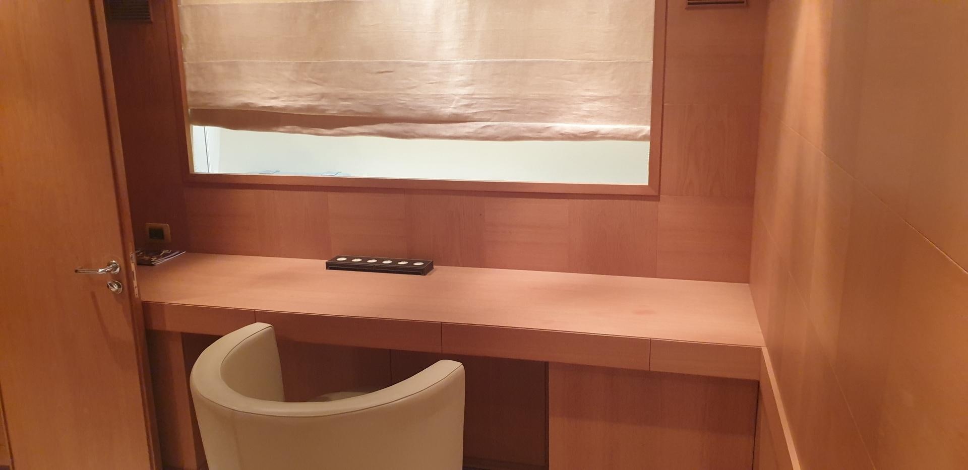 a desk with a phone on it aboard TIGRA Yacht for Sale