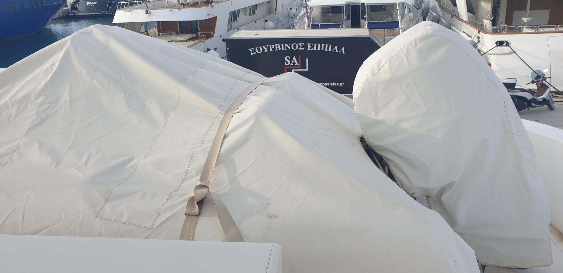 a white tent with a blue sign aboard TIGRA Yacht for Sale