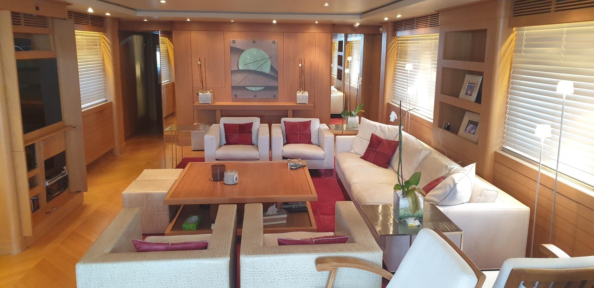 a living room with a couch and a coffee table aboard TIGRA Yacht for Sale