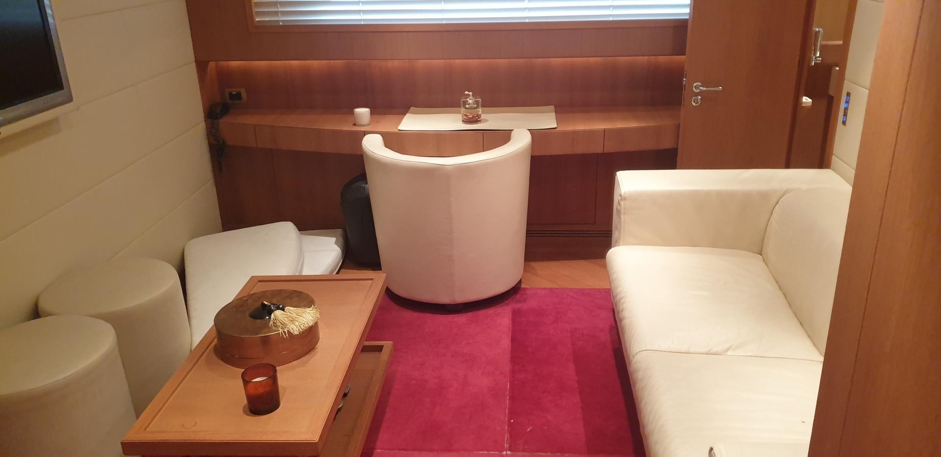 a room with a table and chairs aboard TIGRA Yacht for Sale