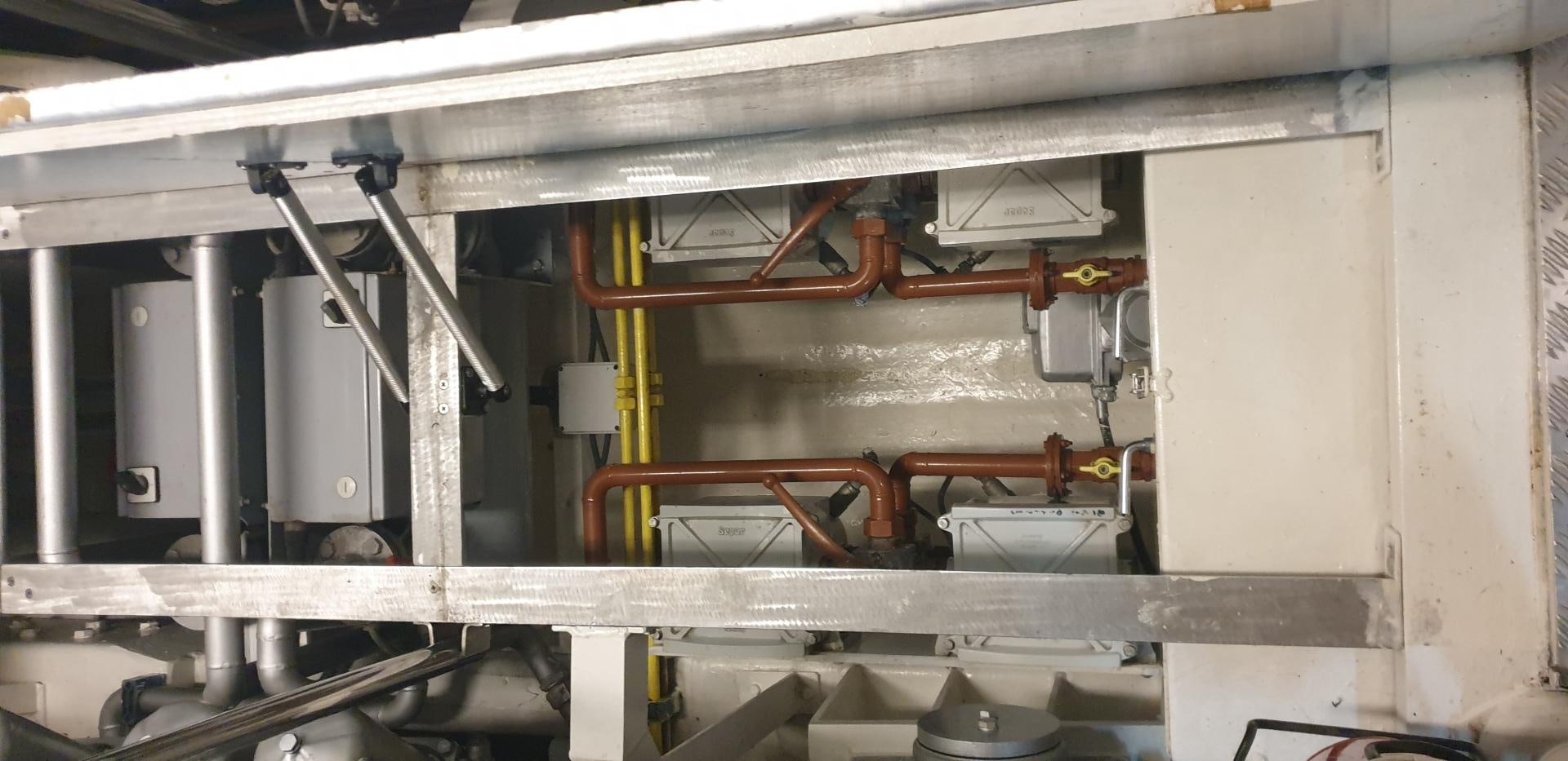 a machine with a large piece of equipment in it aboard TIGRA Yacht for Sale