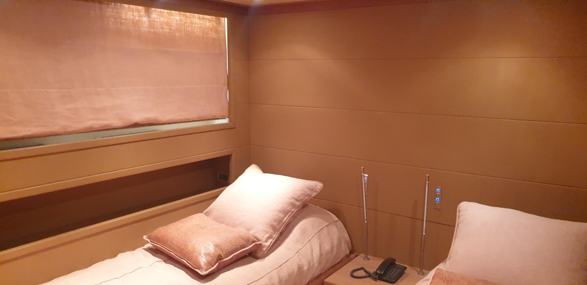 a bed with white sheets aboard TIGRA Yacht for Sale