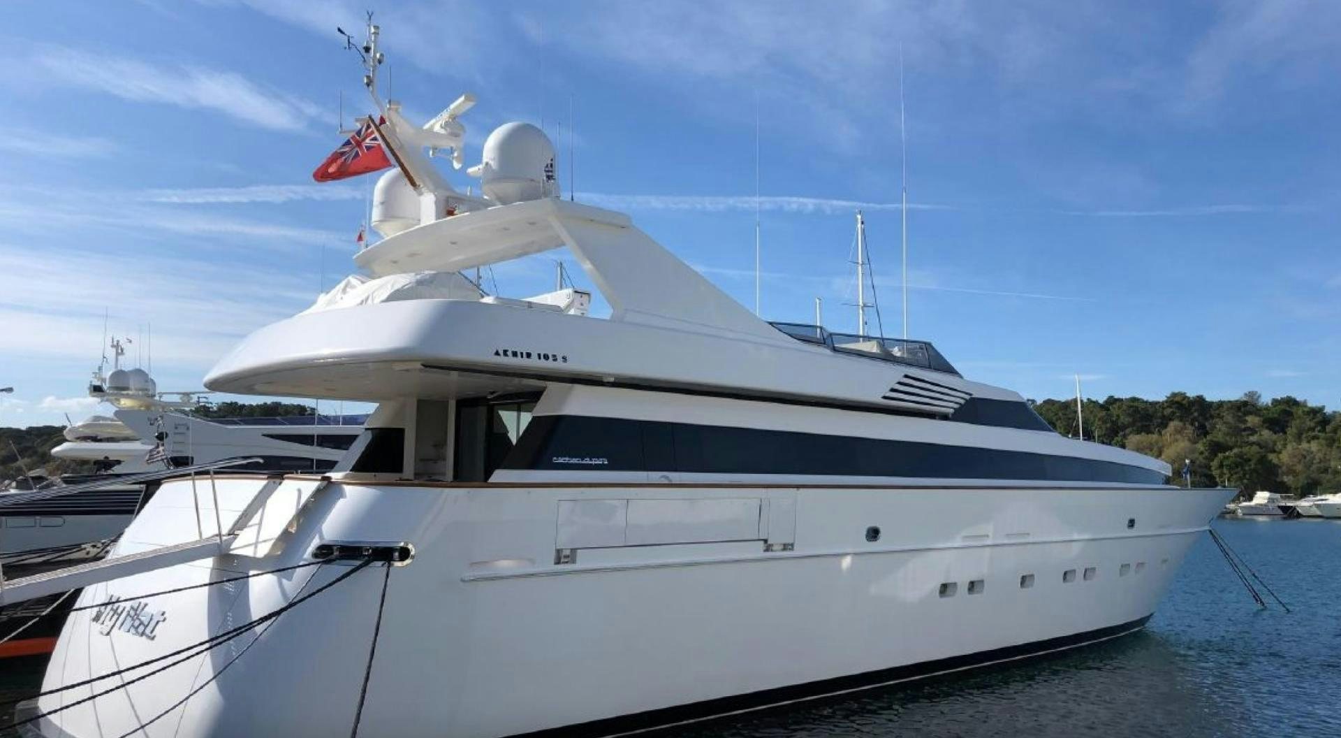 a white yacht on the water aboard TIGRA Yacht for Sale