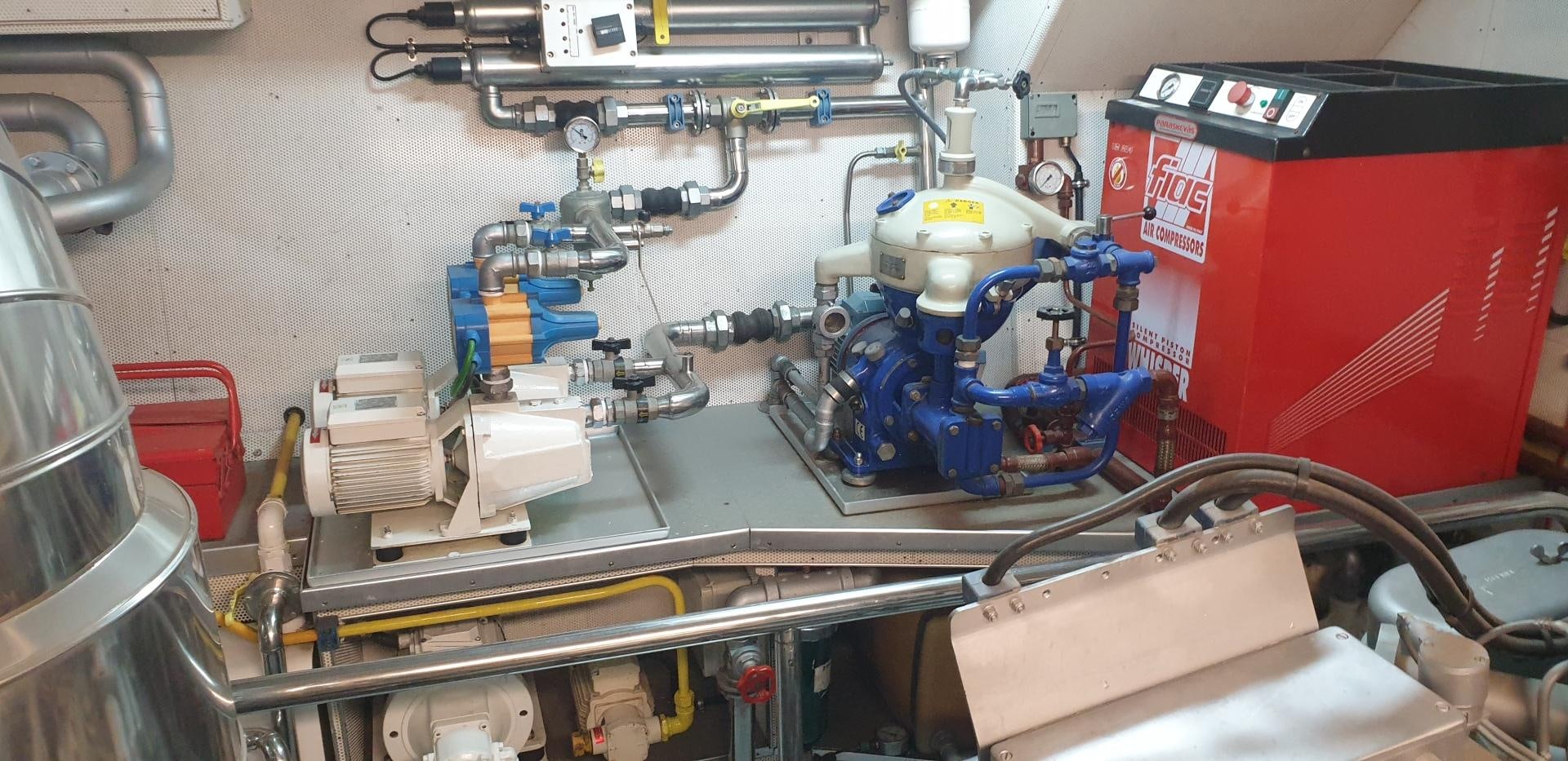 a blue robot in a factory aboard TIGRA Yacht for Sale