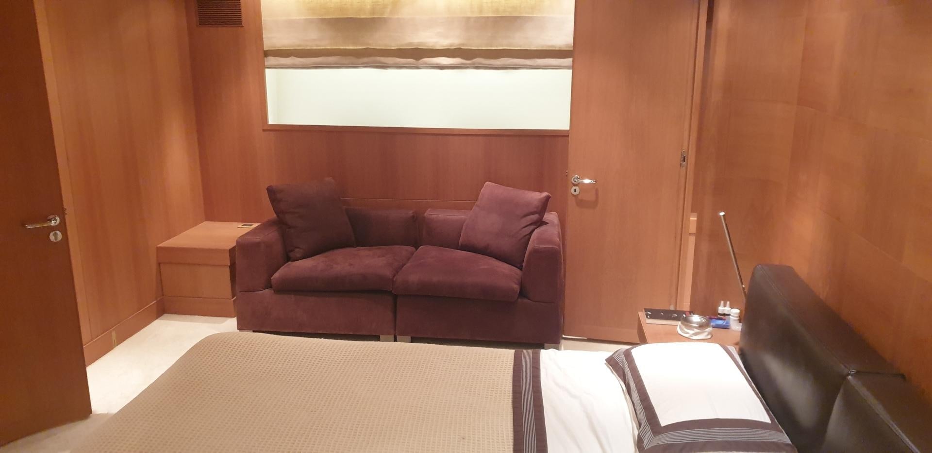 a living room with a couch and a table aboard TIGRA Yacht for Sale