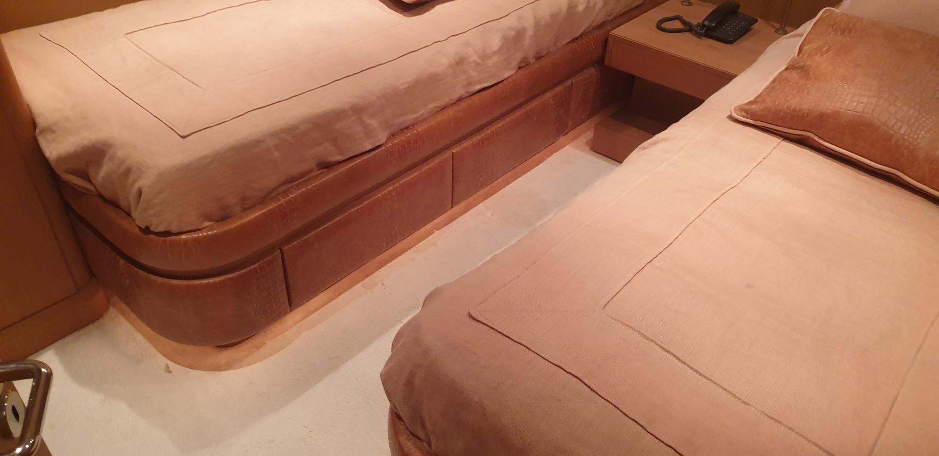 a bed with a white sheet aboard TIGRA Yacht for Sale