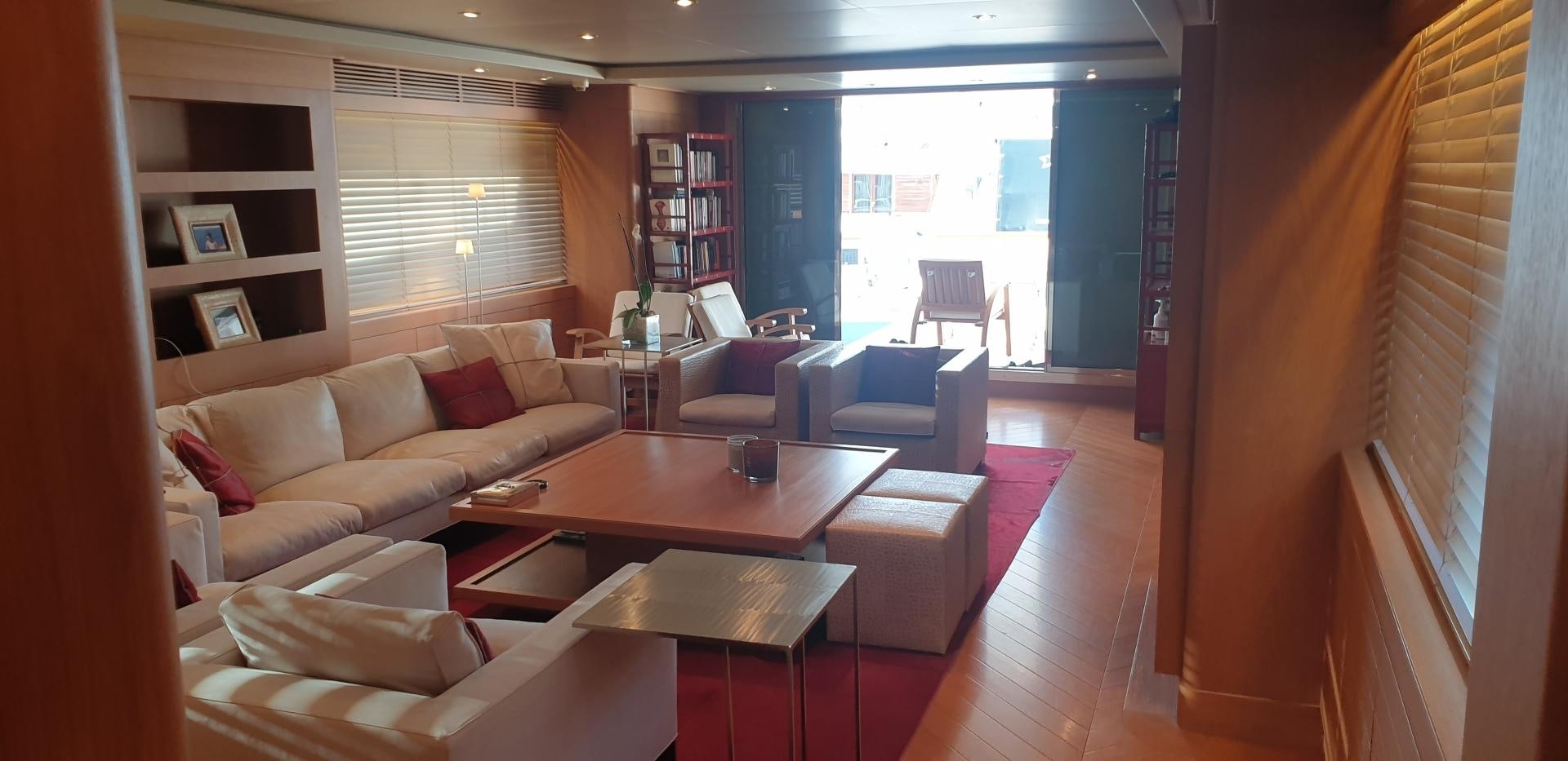 a living room with a table and chairs aboard TIGRA Yacht for Sale