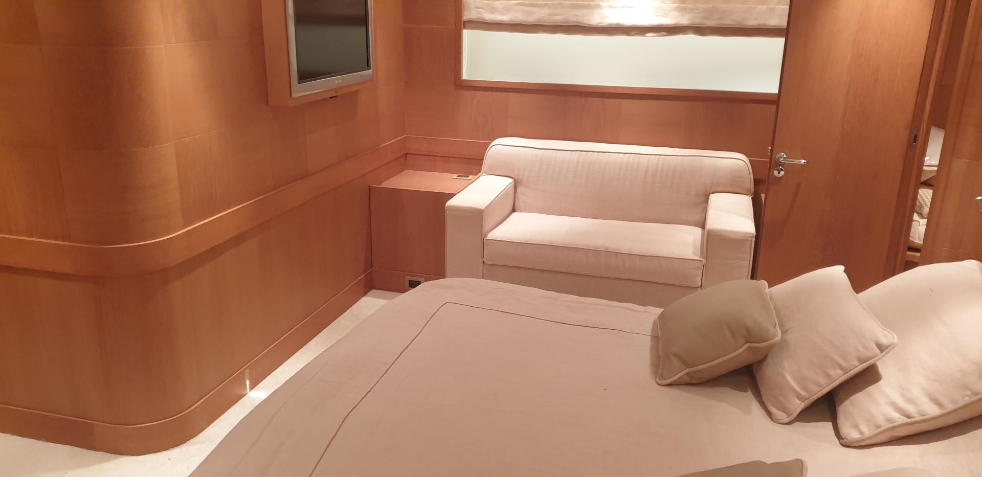 a bed with pillows on it aboard TIGRA Yacht for Sale
