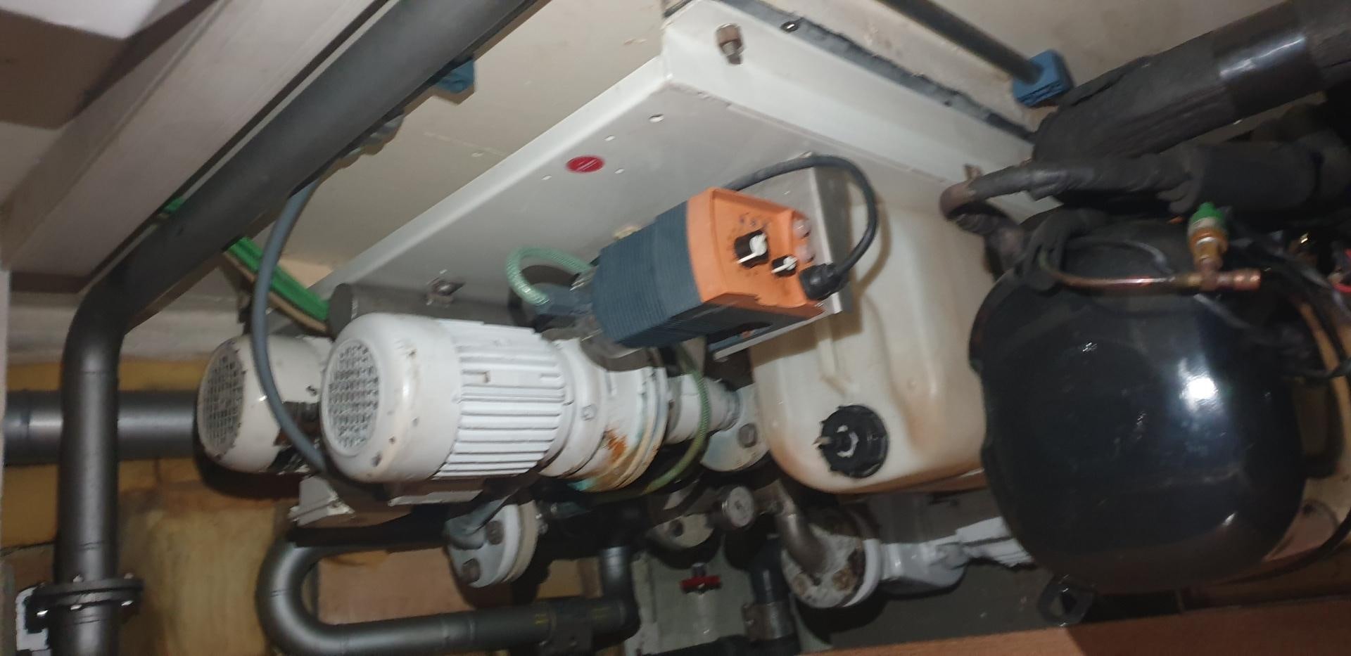 a machine with a large metal cylinder aboard TIGRA Yacht for Sale