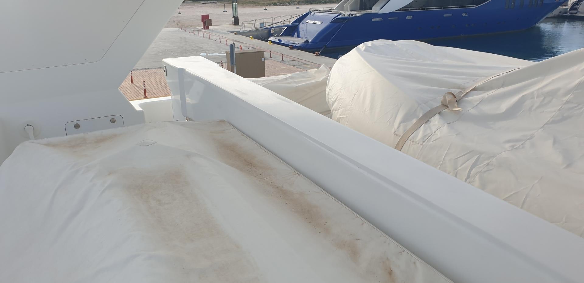 a white boat on a body of water aboard TIGRA Yacht for Sale