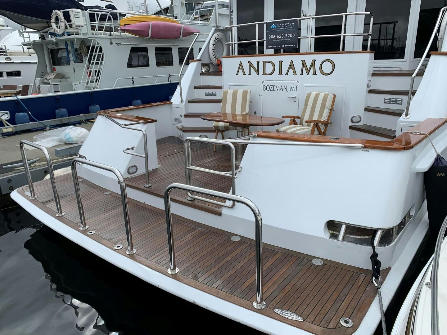 a boat with a sign on the front aboard ANDIAMO Yacht for Sale