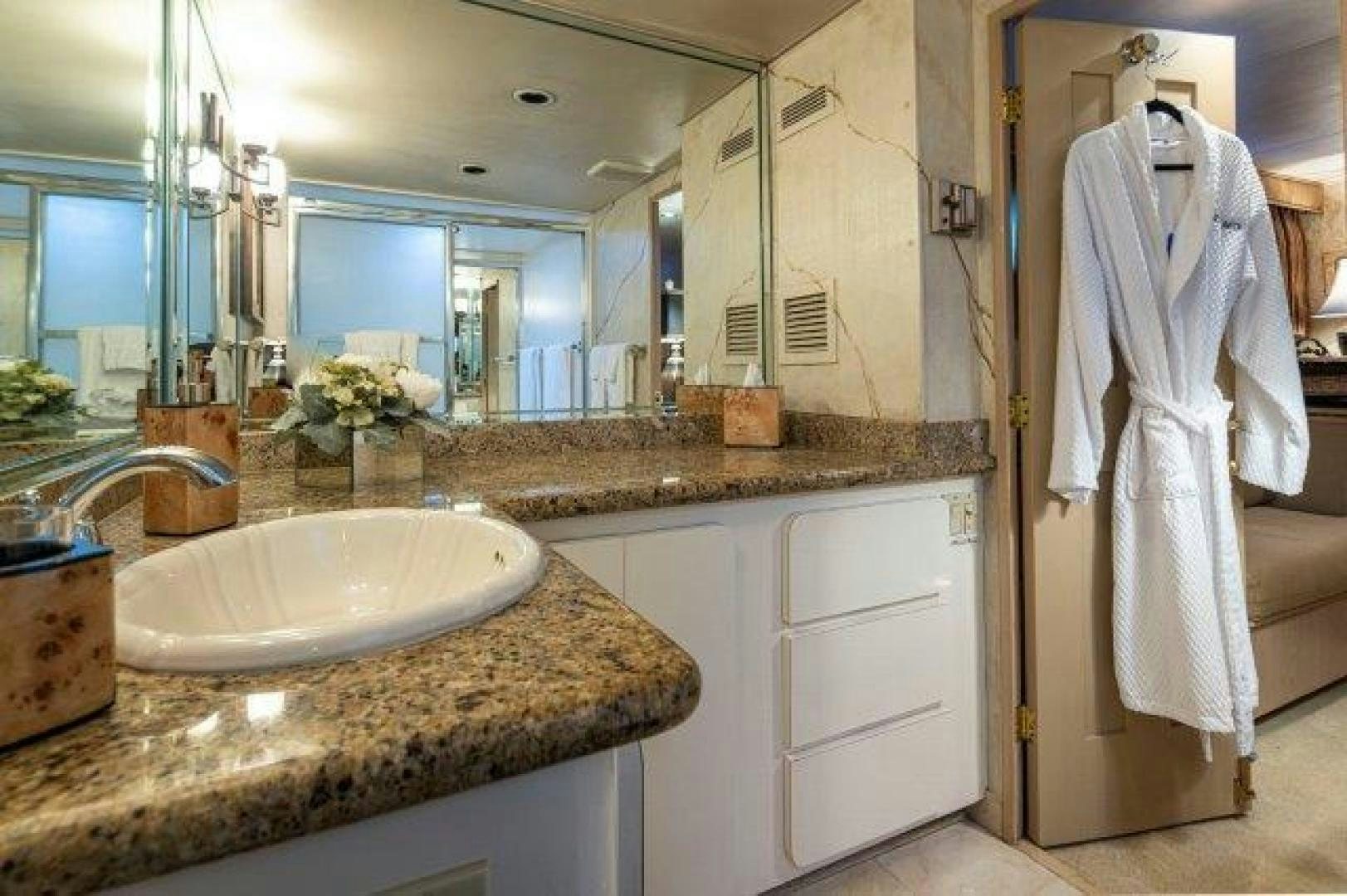 a bathroom with a large mirror aboard ANDIAMO Yacht for Sale