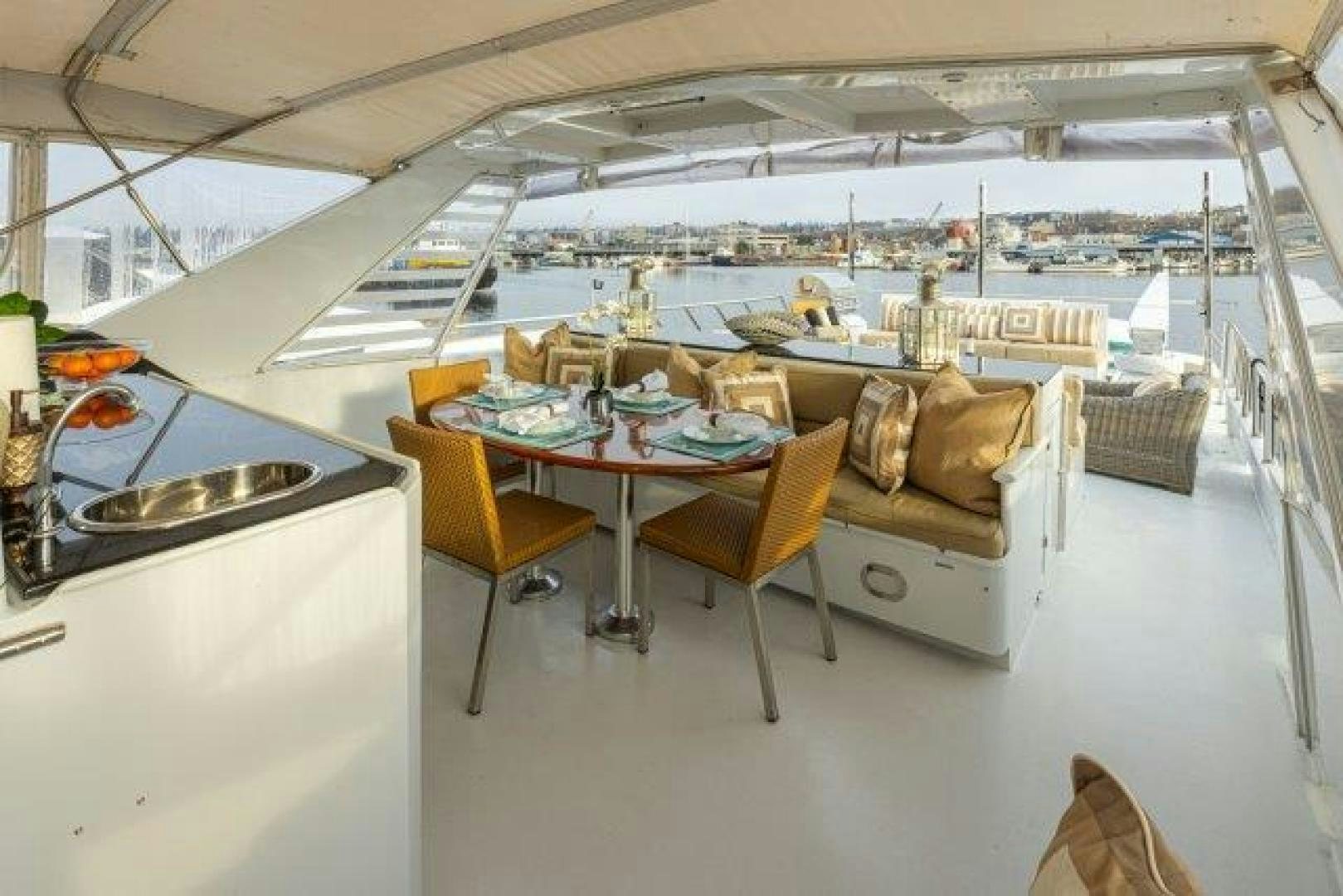 a room with a table and chairs aboard ANDIAMO Yacht for Sale