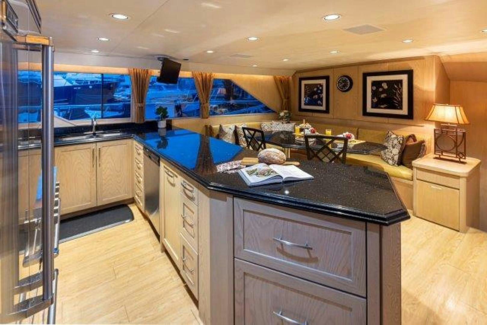 a kitchen with a large glass window aboard ANDIAMO Yacht for Sale