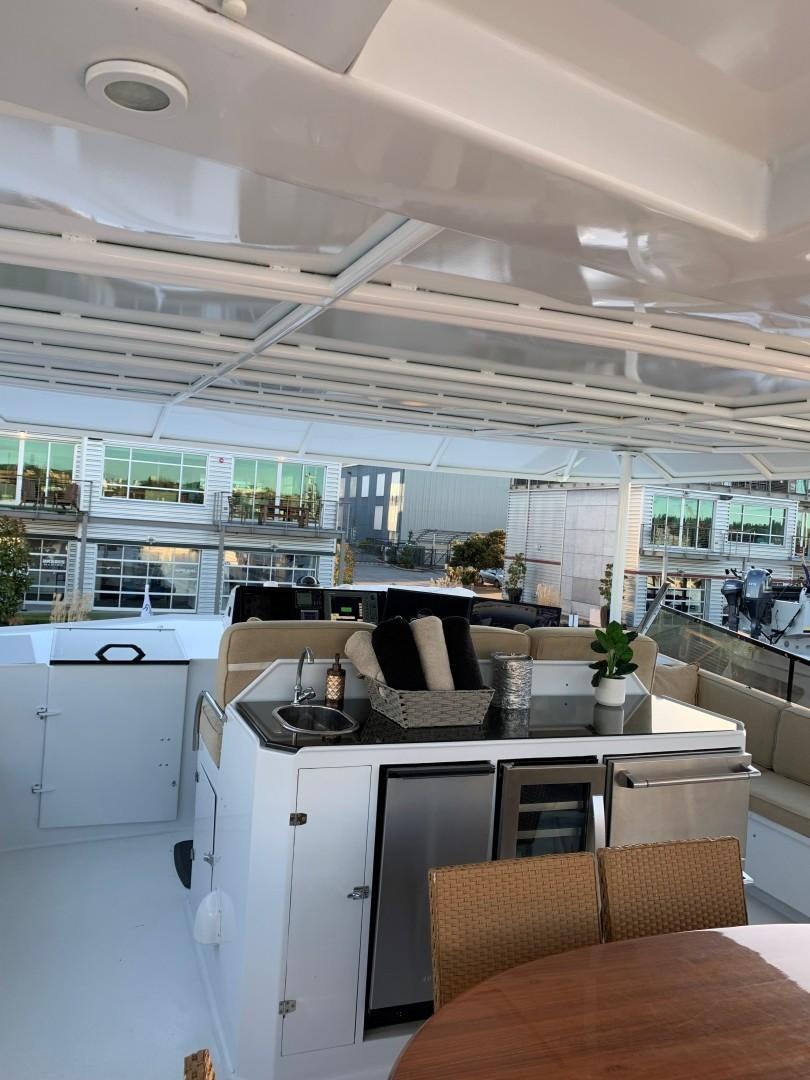 a kitchen with white cabinets aboard ANDIAMO Yacht for Sale