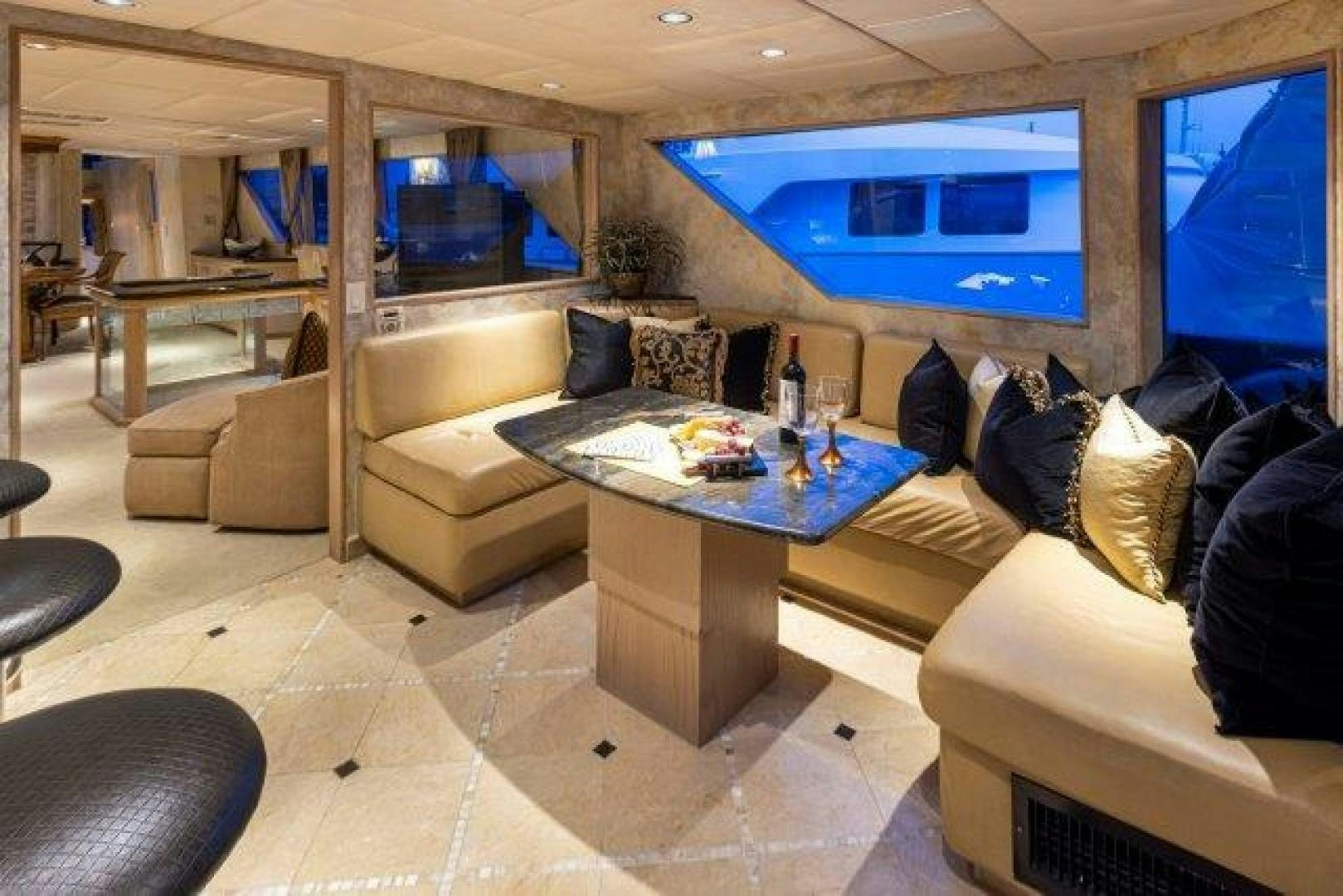 a room with a couch and a table aboard ANDIAMO Yacht for Sale