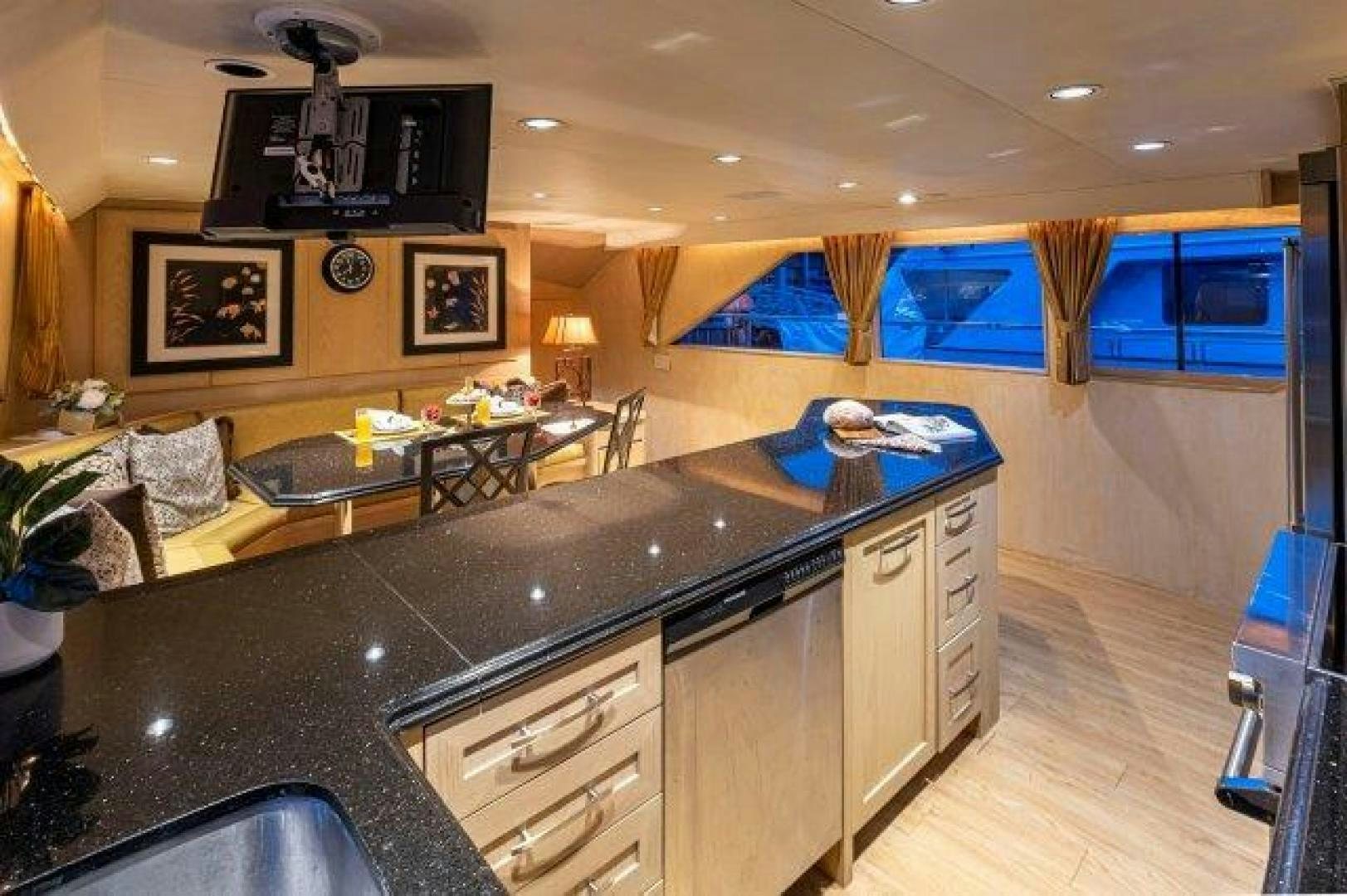 a kitchen with a large island aboard ANDIAMO Yacht for Sale