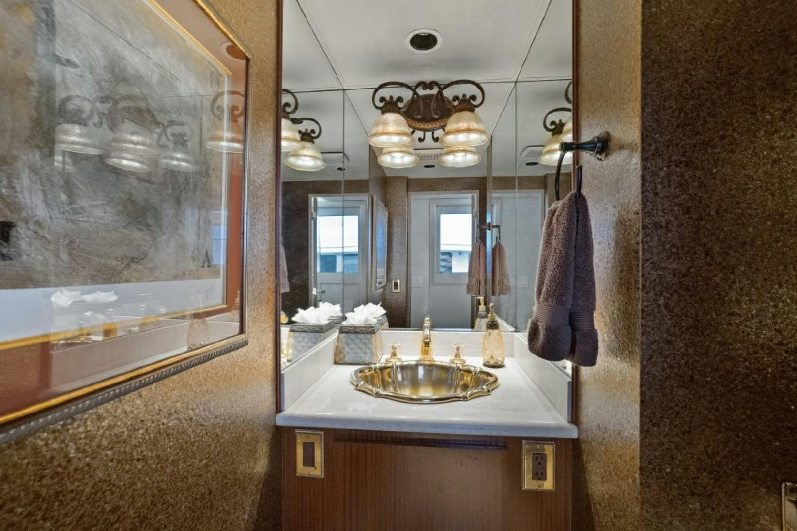 a bathroom with a sink and a mirror aboard ANDIAMO Yacht for Sale