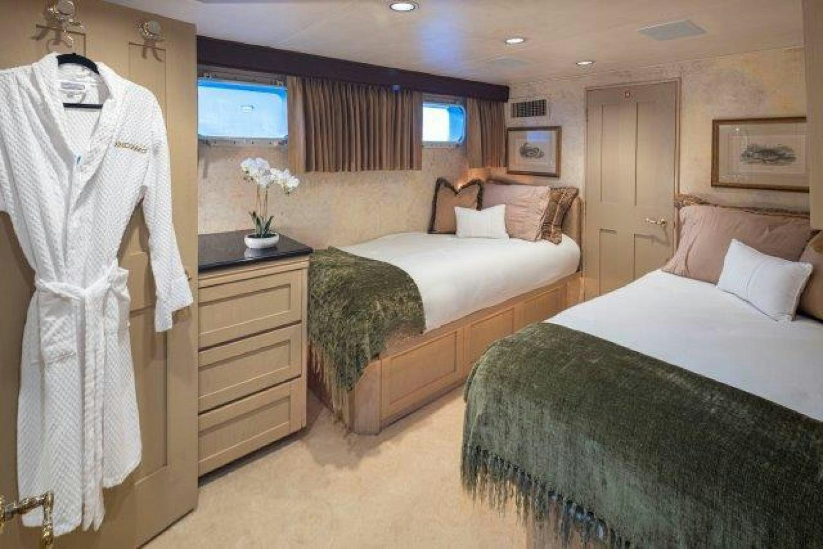 a room with two beds aboard ANDIAMO Yacht for Sale