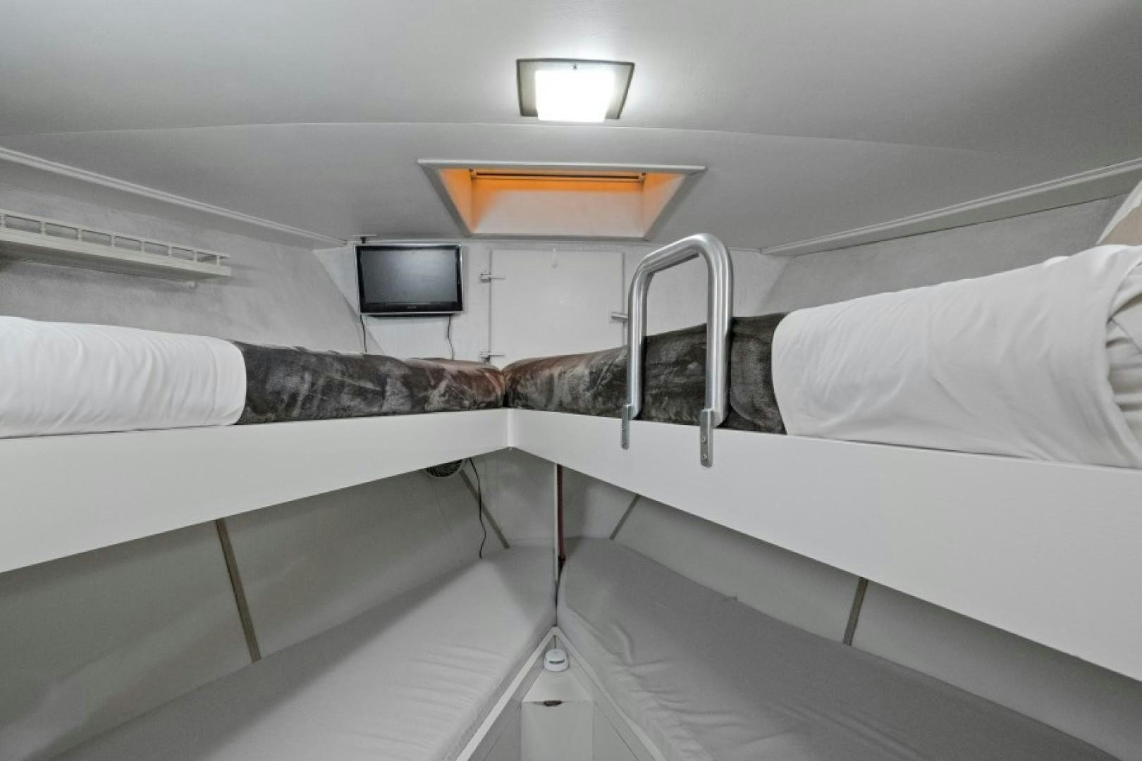 a person lying on a bed aboard ANDIAMO Yacht for Sale