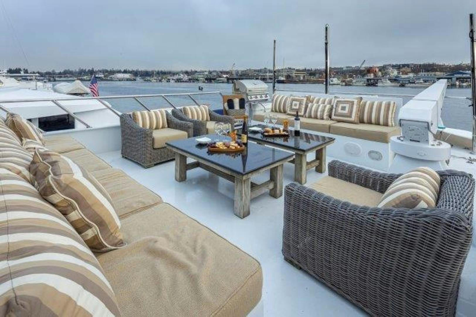 a living room with a couch and a table and chairs aboard ANDIAMO Yacht for Sale