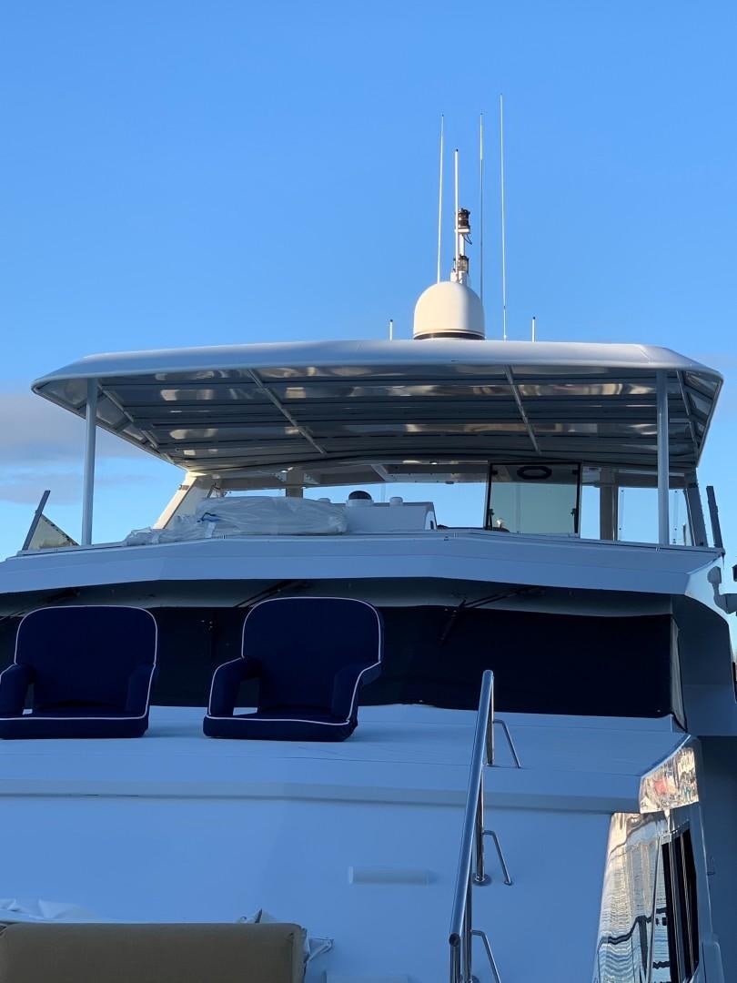 a boat with a white tower aboard ANDIAMO Yacht for Sale