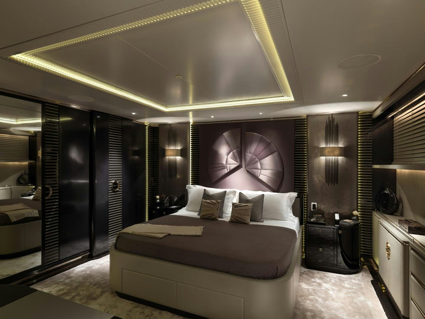 a large bedroom with a large mirror aboard SEALYON Yacht for Sale