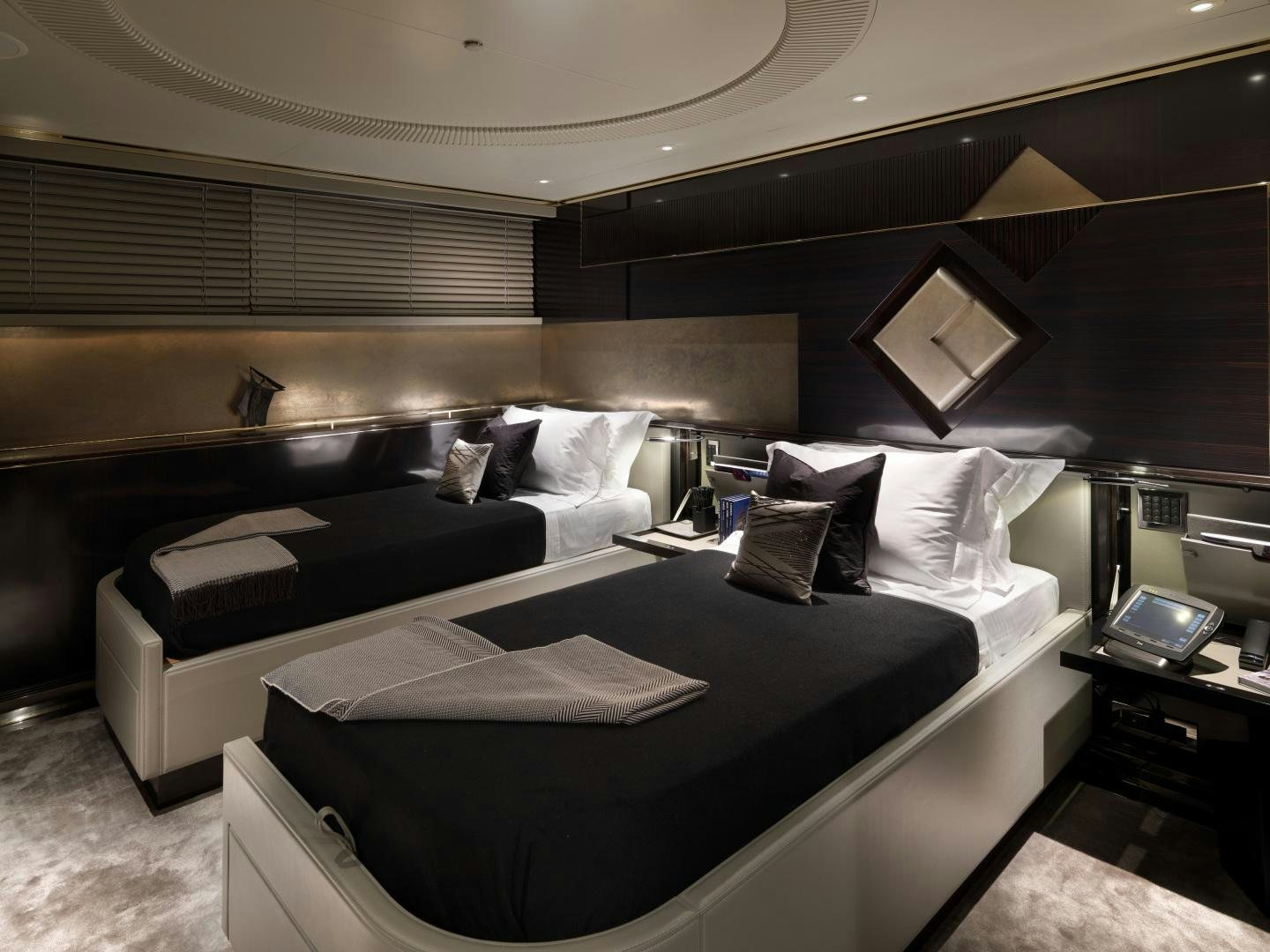 a bed with a black bed spread aboard SEALYON Yacht for Sale