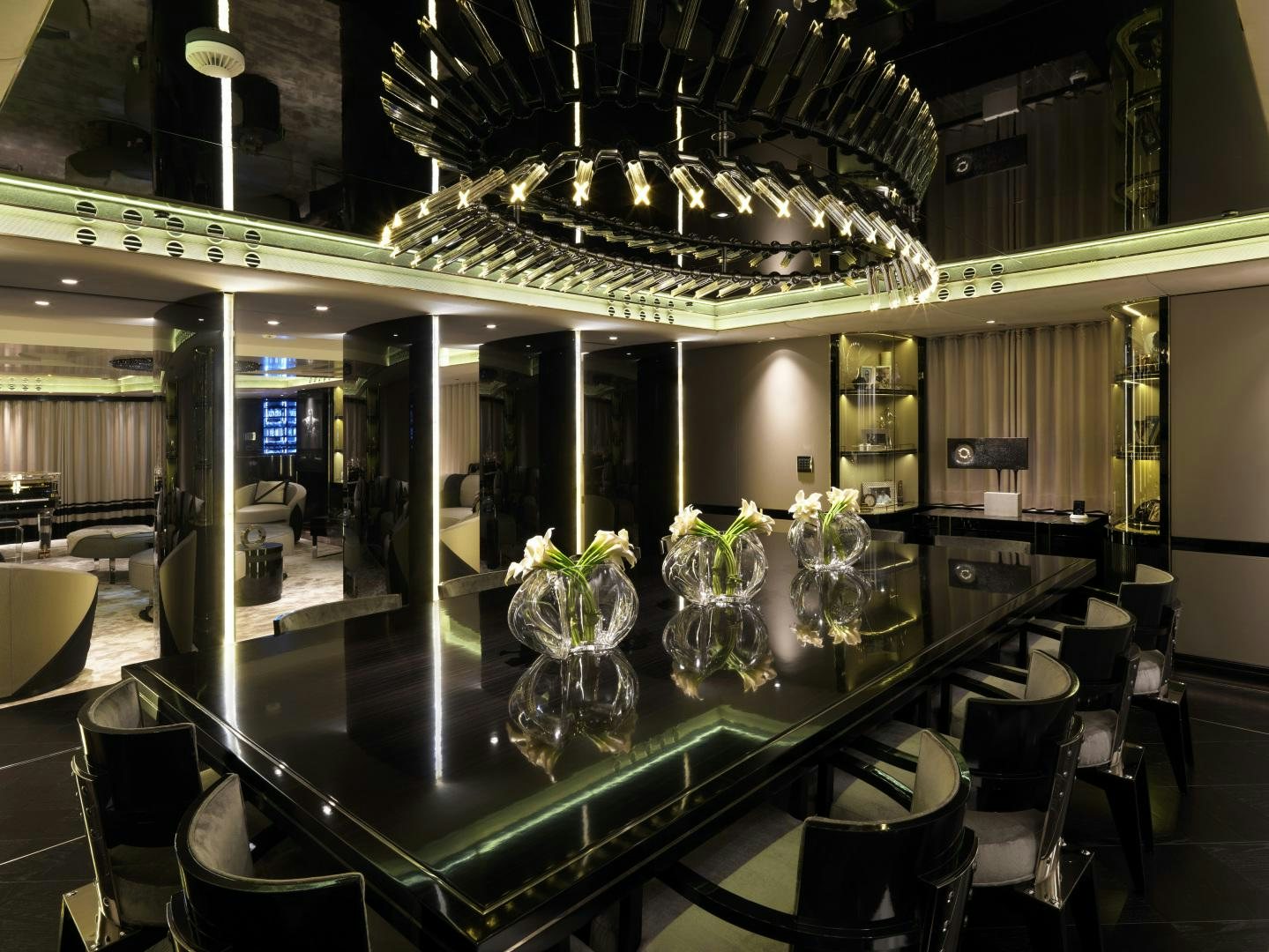 a room with tables and chairs aboard SEALYON Yacht for Sale