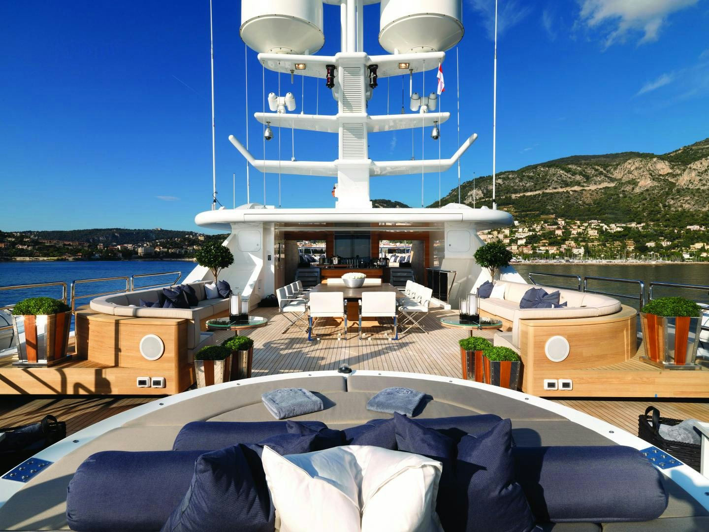 a large white building with a balcony overlooking a body of water aboard SEALYON Yacht for Sale