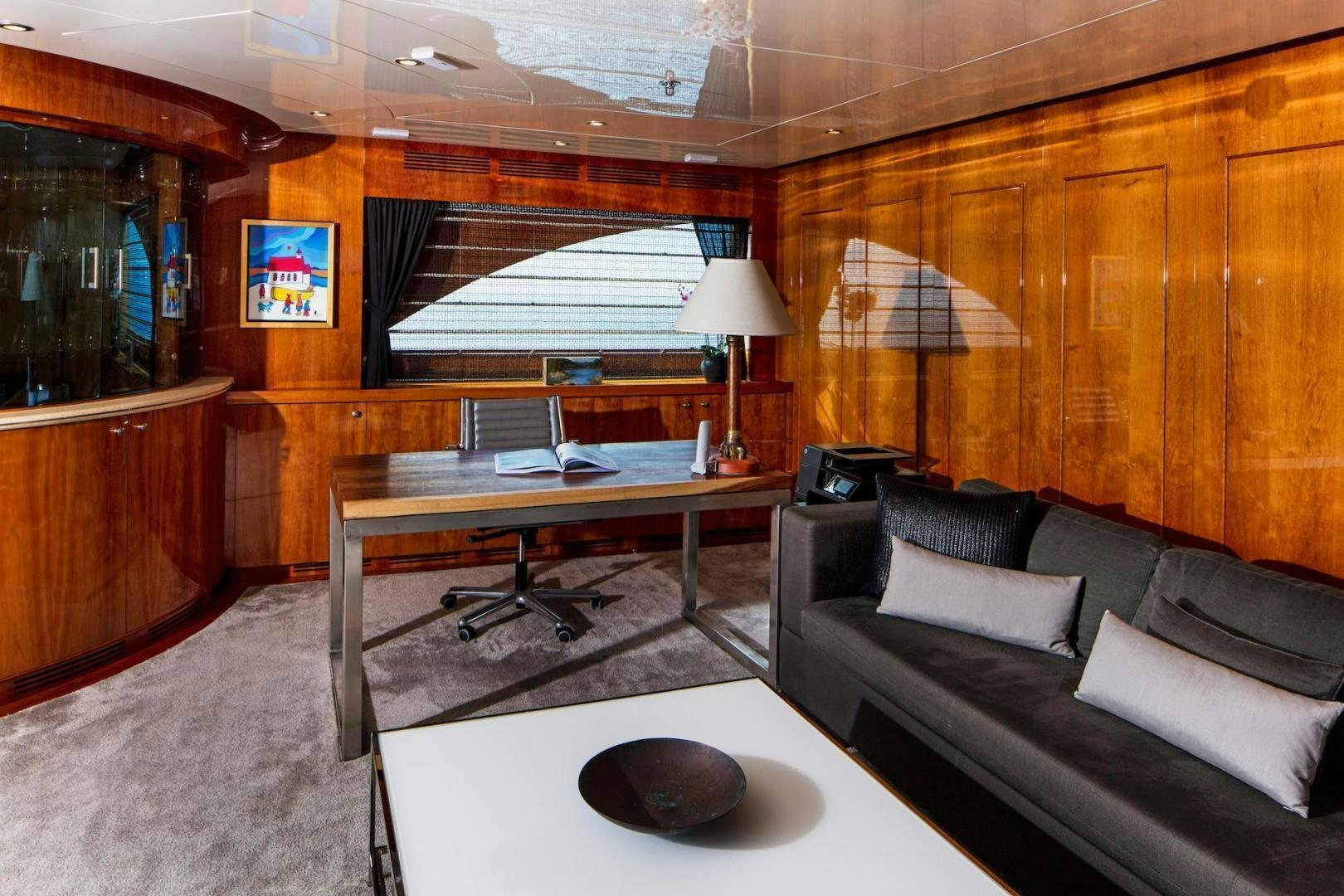 a living room with a couch and a table aboard STAY SALTY Yacht for Sale
