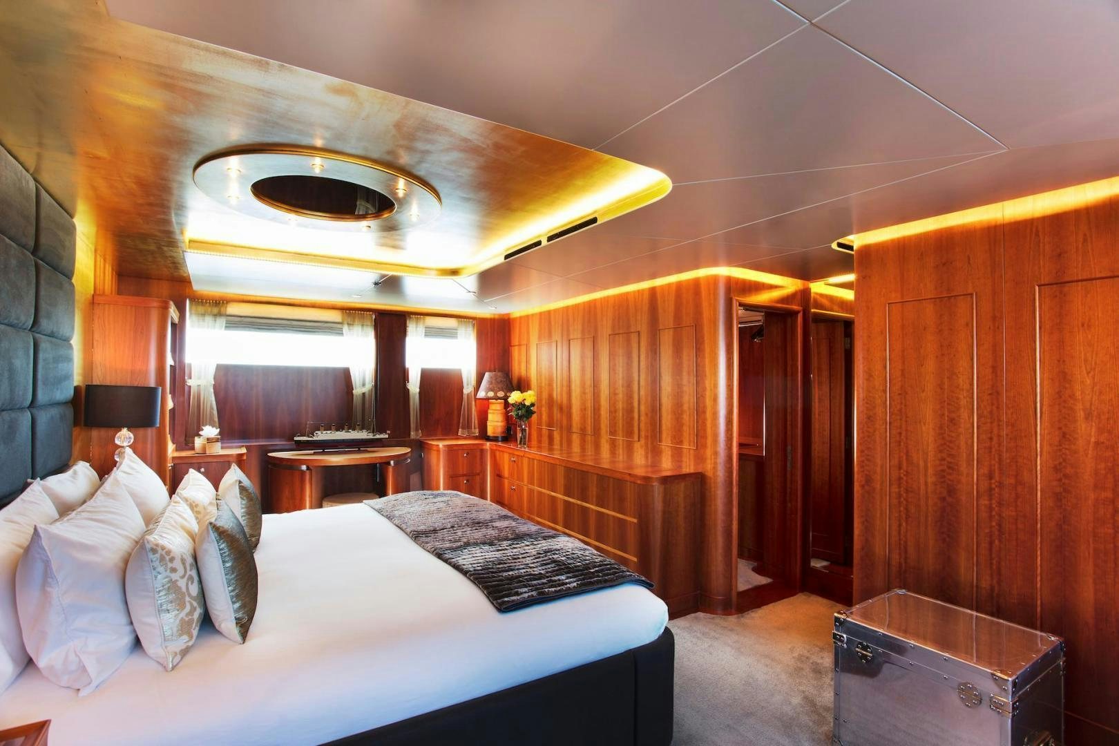 a room with a bed and a table aboard STAY SALTY Yacht for Sale