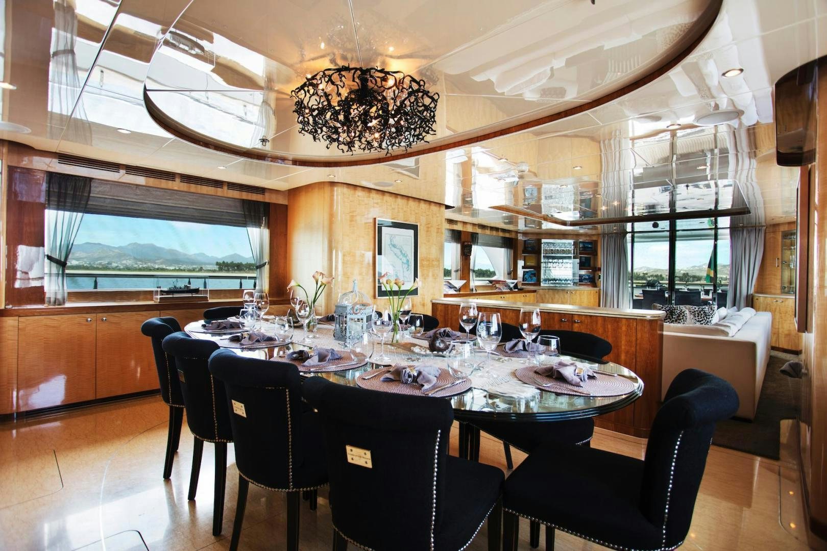 a large dining room with a large table and chairs aboard STAY SALTY Yacht for Sale