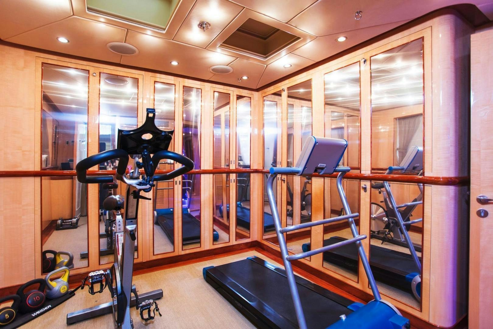 a gym with equipment aboard STAY SALTY Yacht for Sale