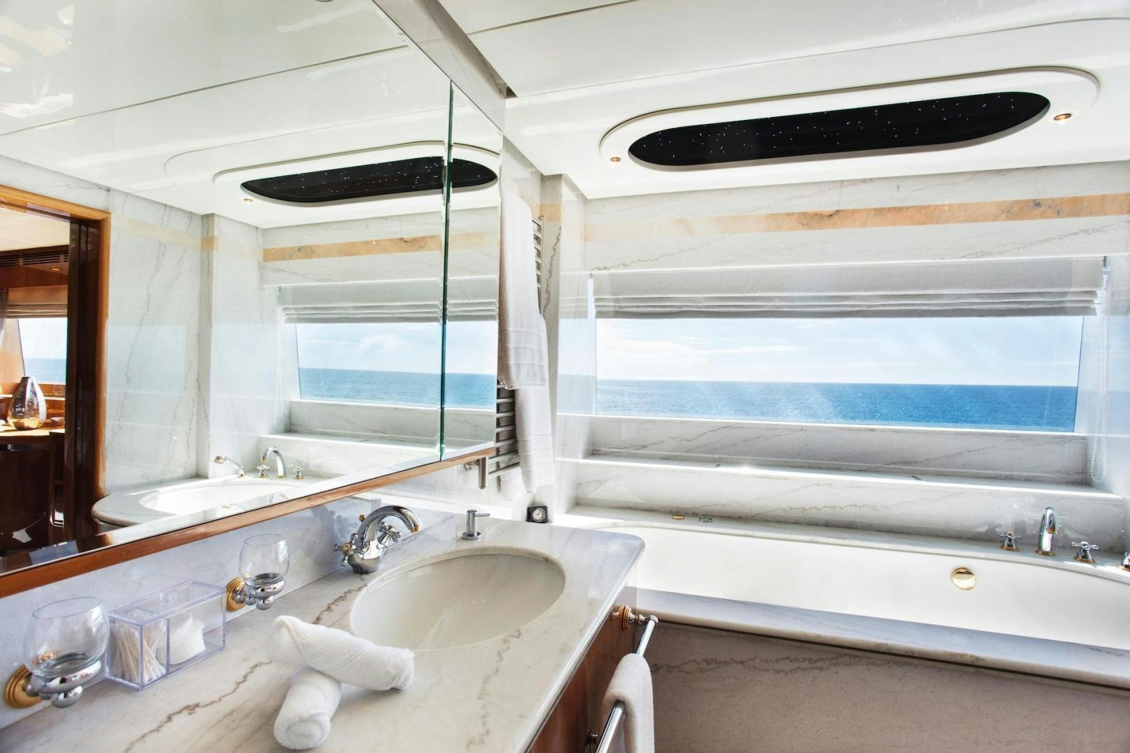 a bathroom with a sink and a bathtub aboard STAY SALTY Yacht for Sale