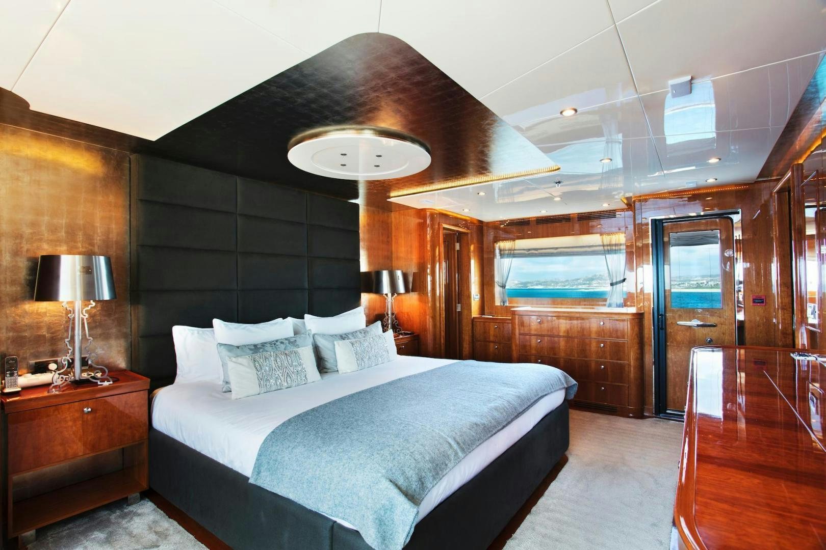 a large bedroom with a large bed aboard STAY SALTY Yacht for Sale