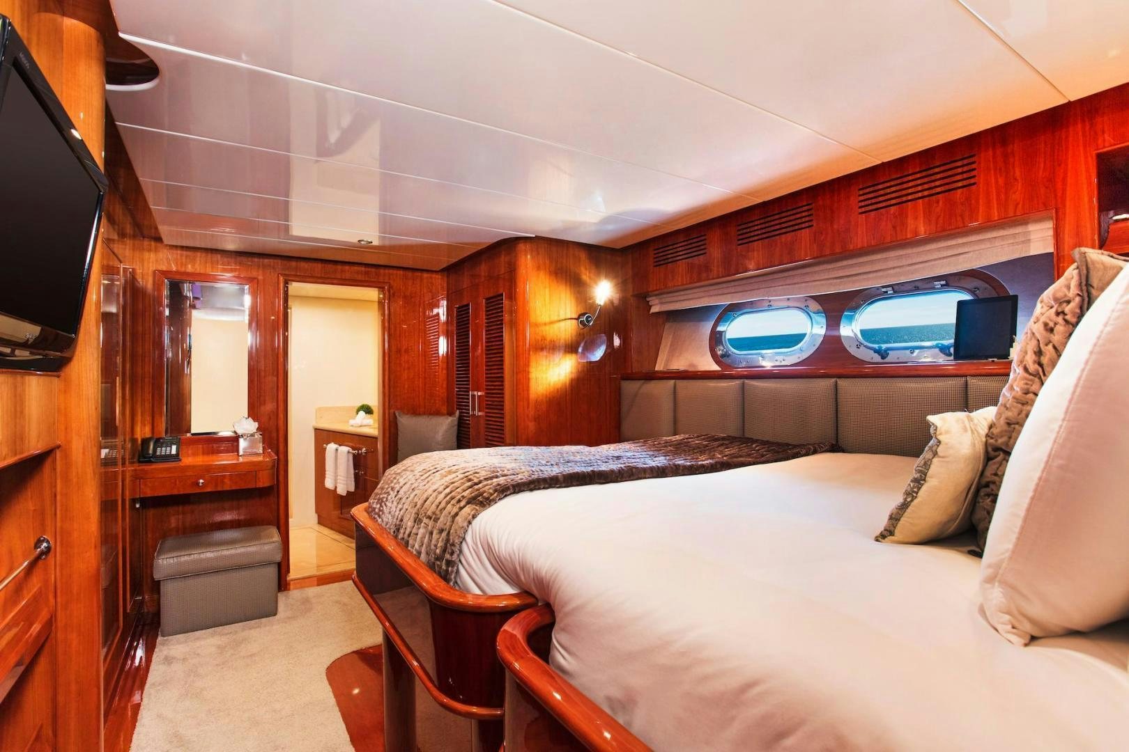 a room with a bed and a television aboard STAY SALTY Yacht for Sale