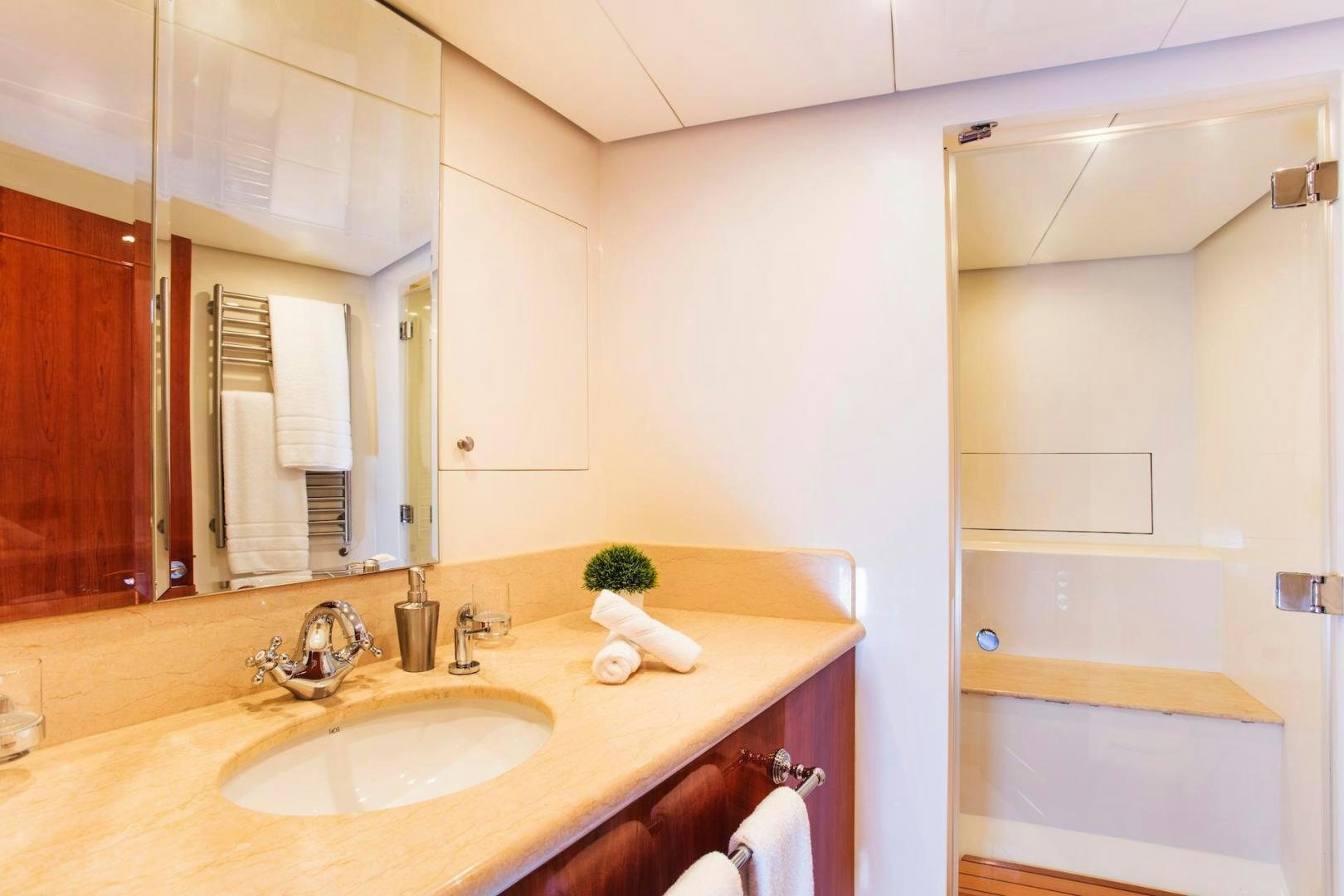 a bathroom with a sink and a mirror aboard STAY SALTY Yacht for Sale