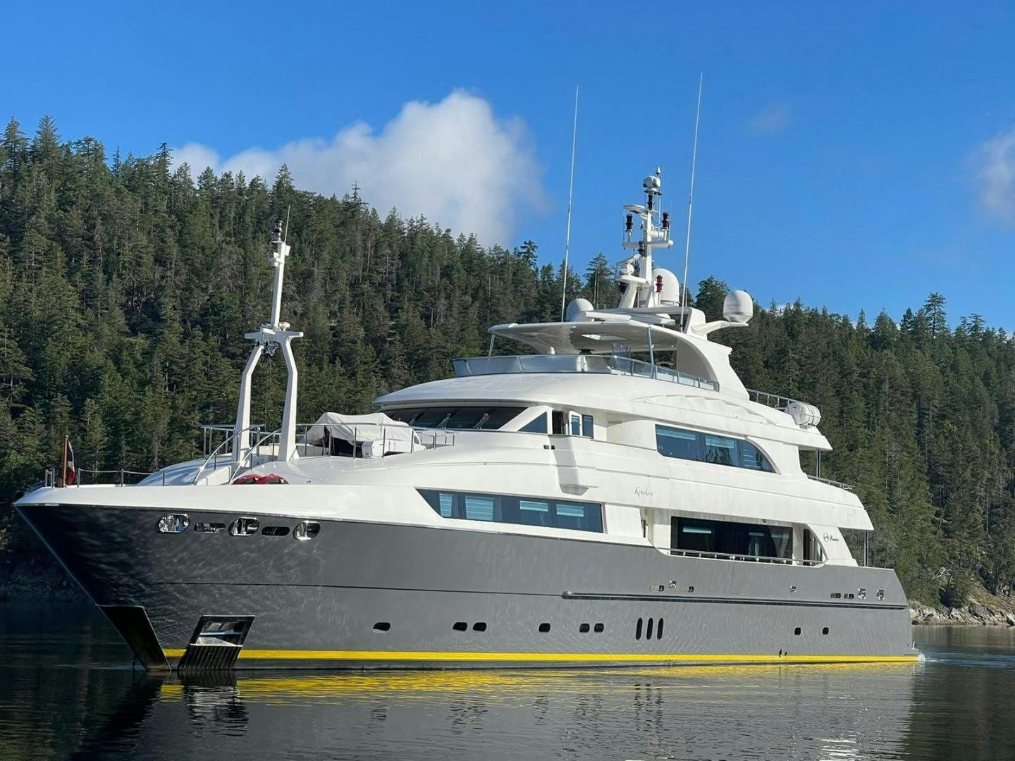 a large white boat on the water aboard STAY SALTY Yacht for Sale