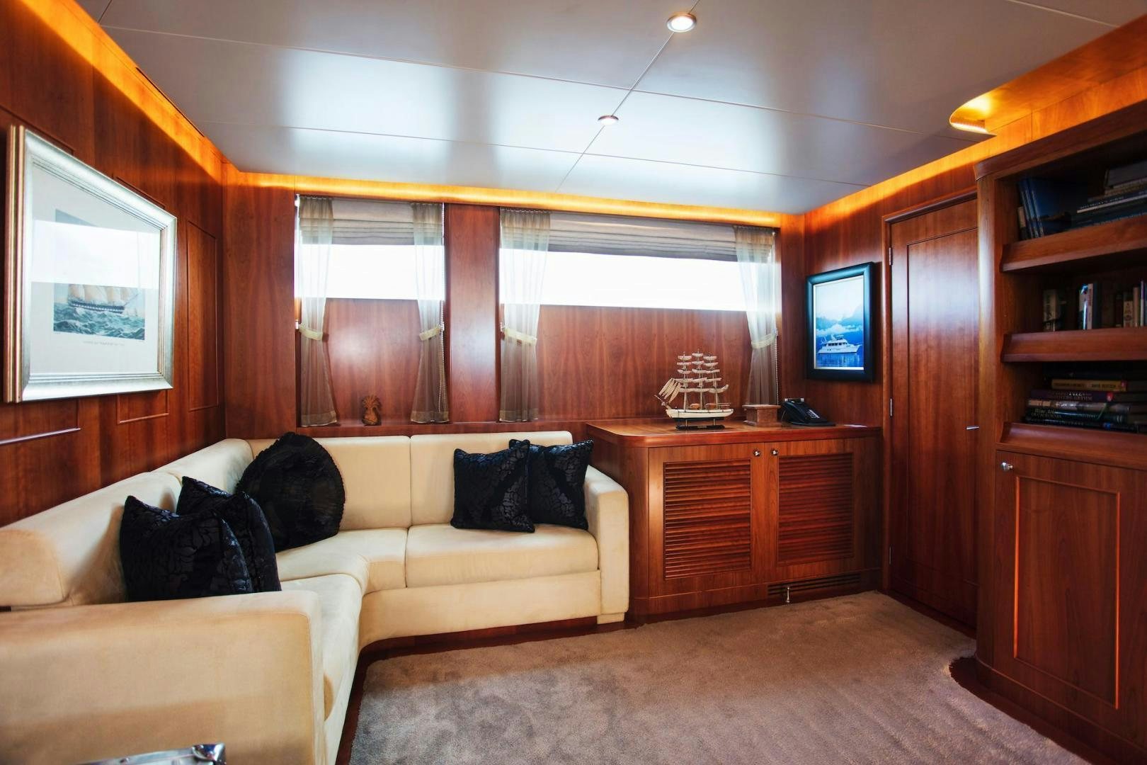 a living room with a couch and a tv aboard STAY SALTY Yacht for Sale