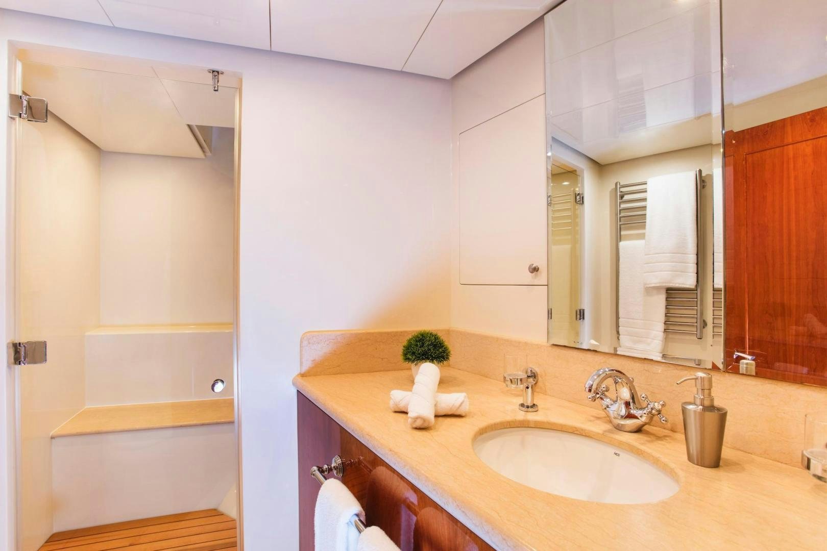 a bathroom with a sink and mirror aboard STAY SALTY Yacht for Sale