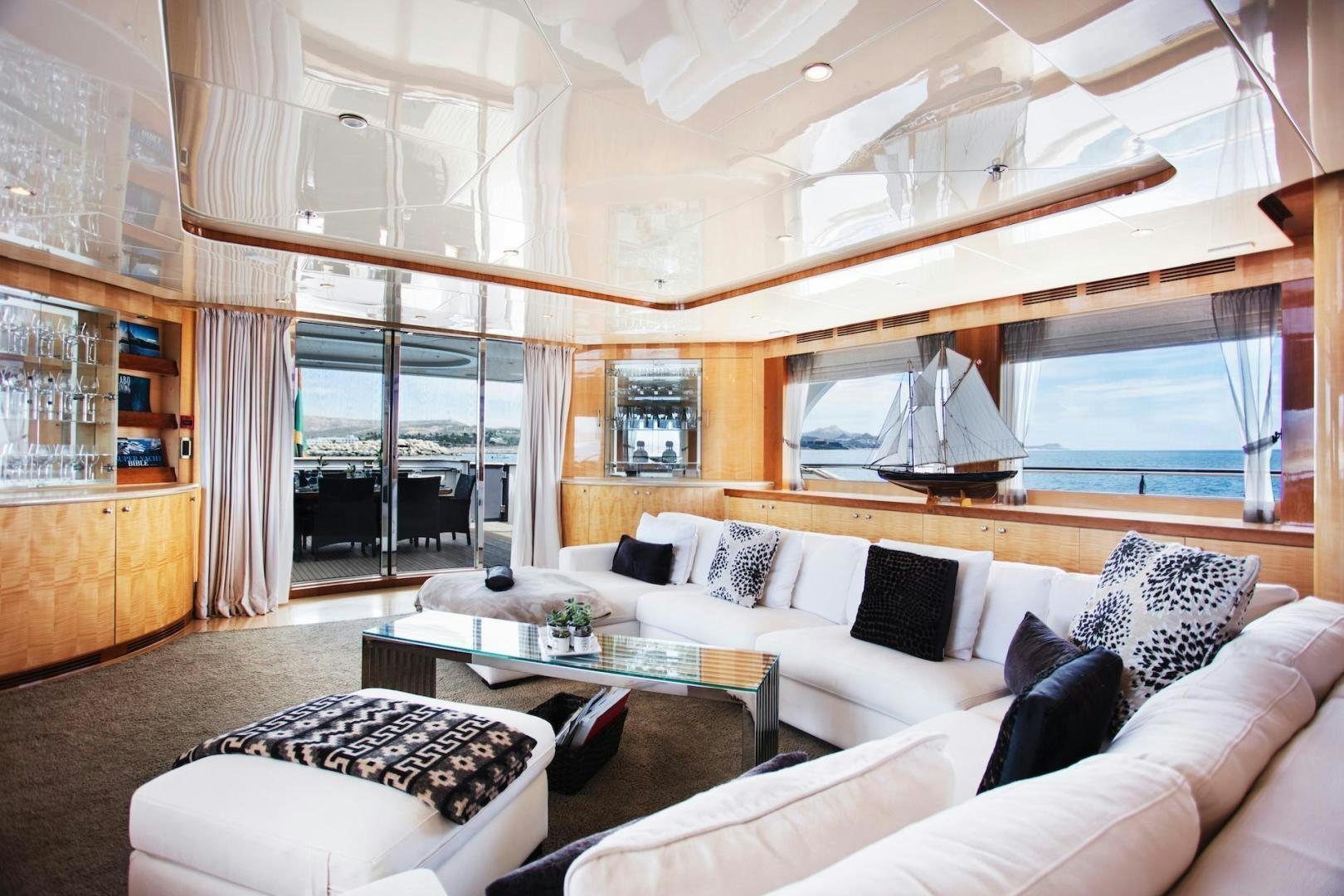 a room with a couch and a table aboard STAY SALTY Yacht for Sale