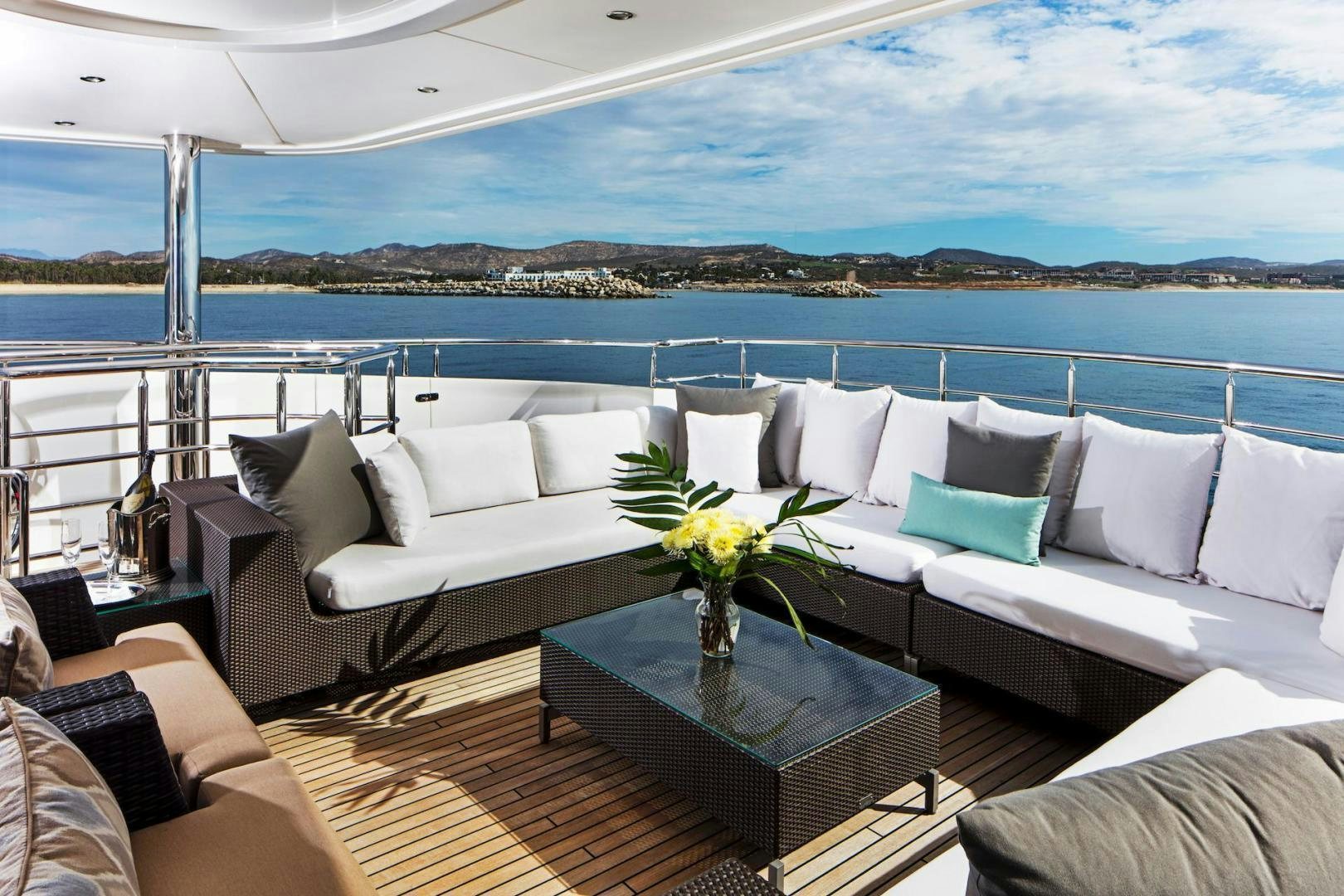 a living room with a large window overlooking the ocean aboard STAY SALTY Yacht for Sale