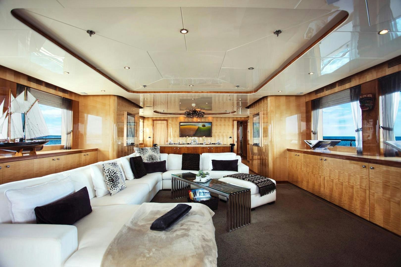 a living room with a couch and a coffee table aboard STAY SALTY Yacht for Sale