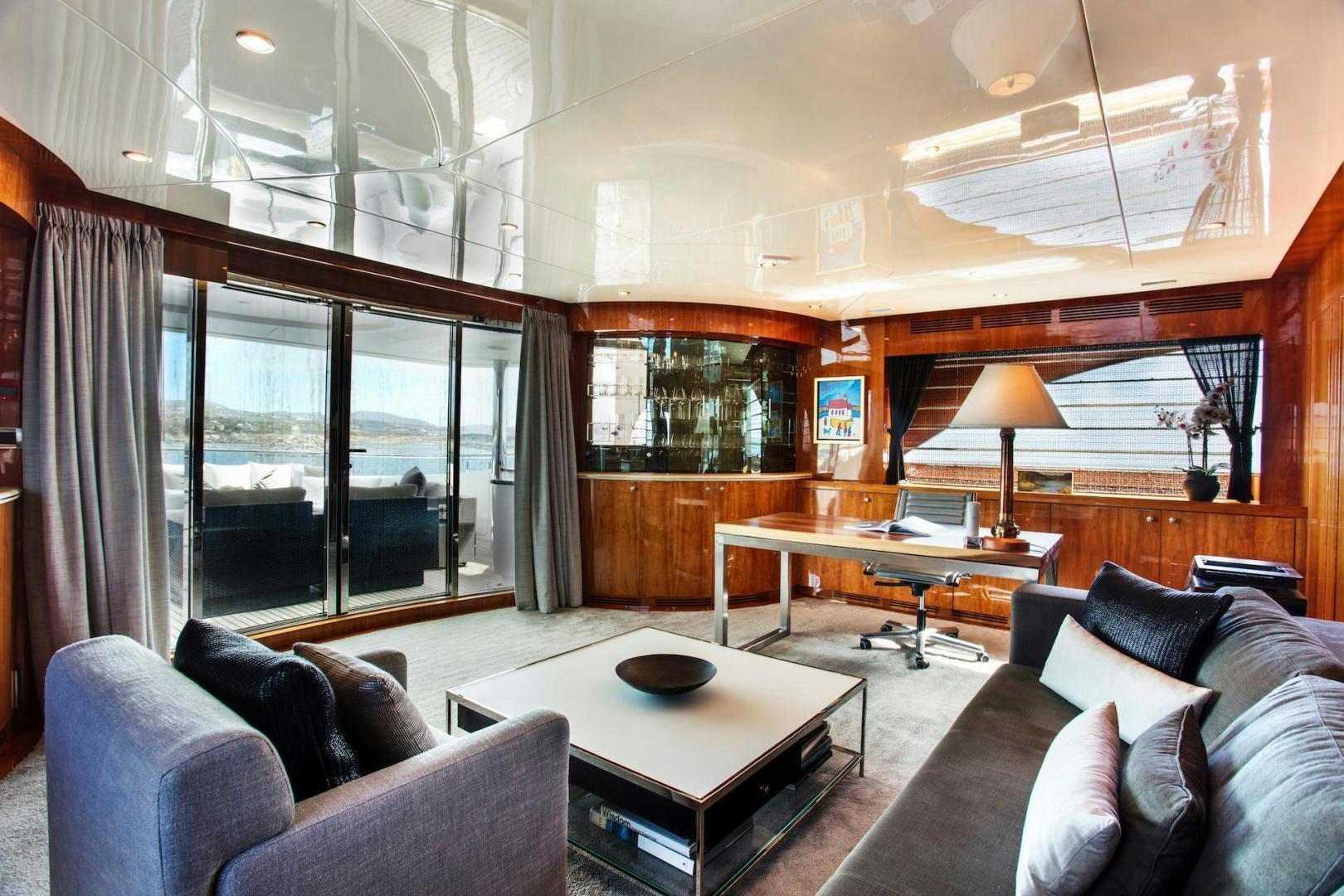 a living room with a large window aboard STAY SALTY Yacht for Sale