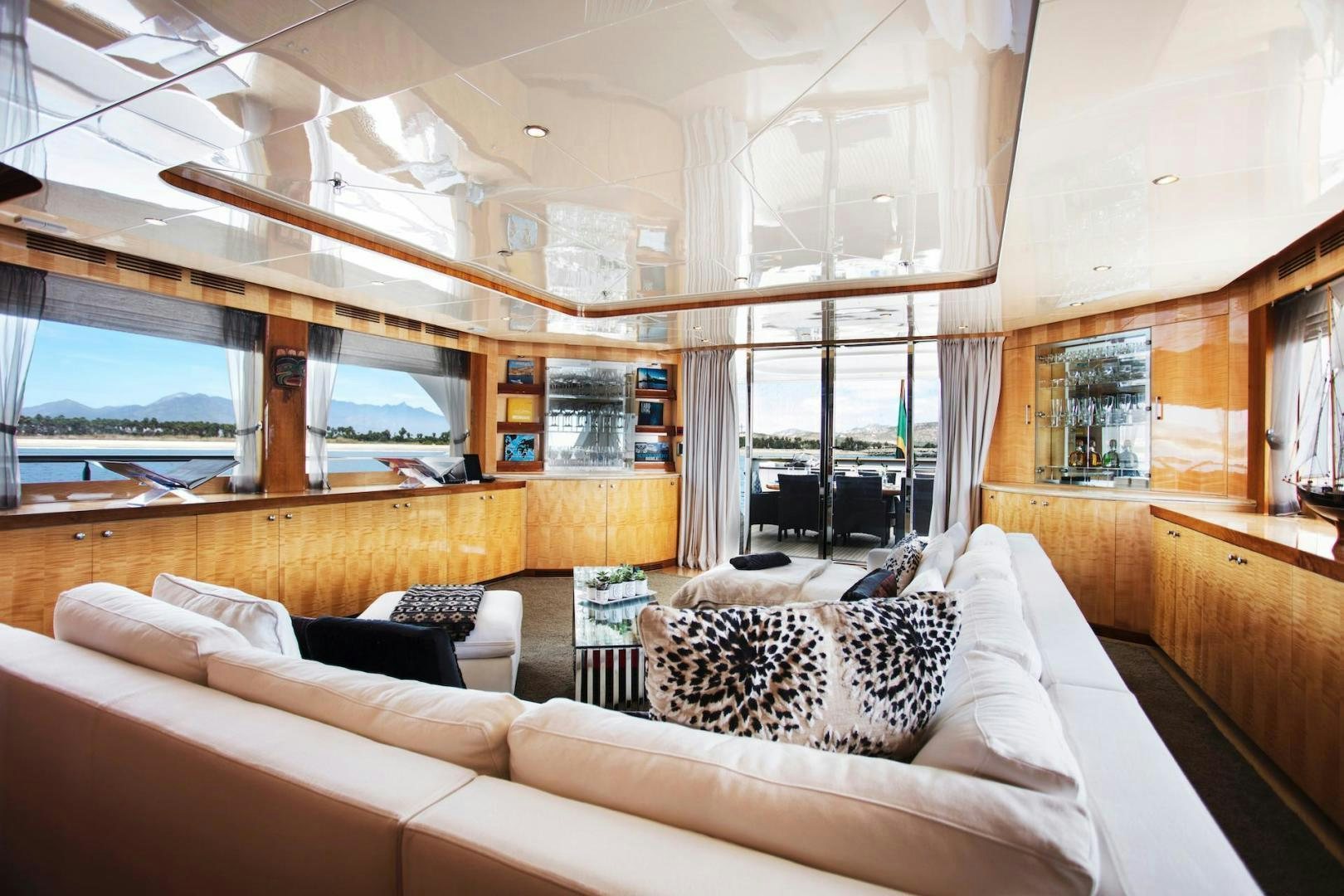 a living room with a large window aboard STAY SALTY Yacht for Sale
