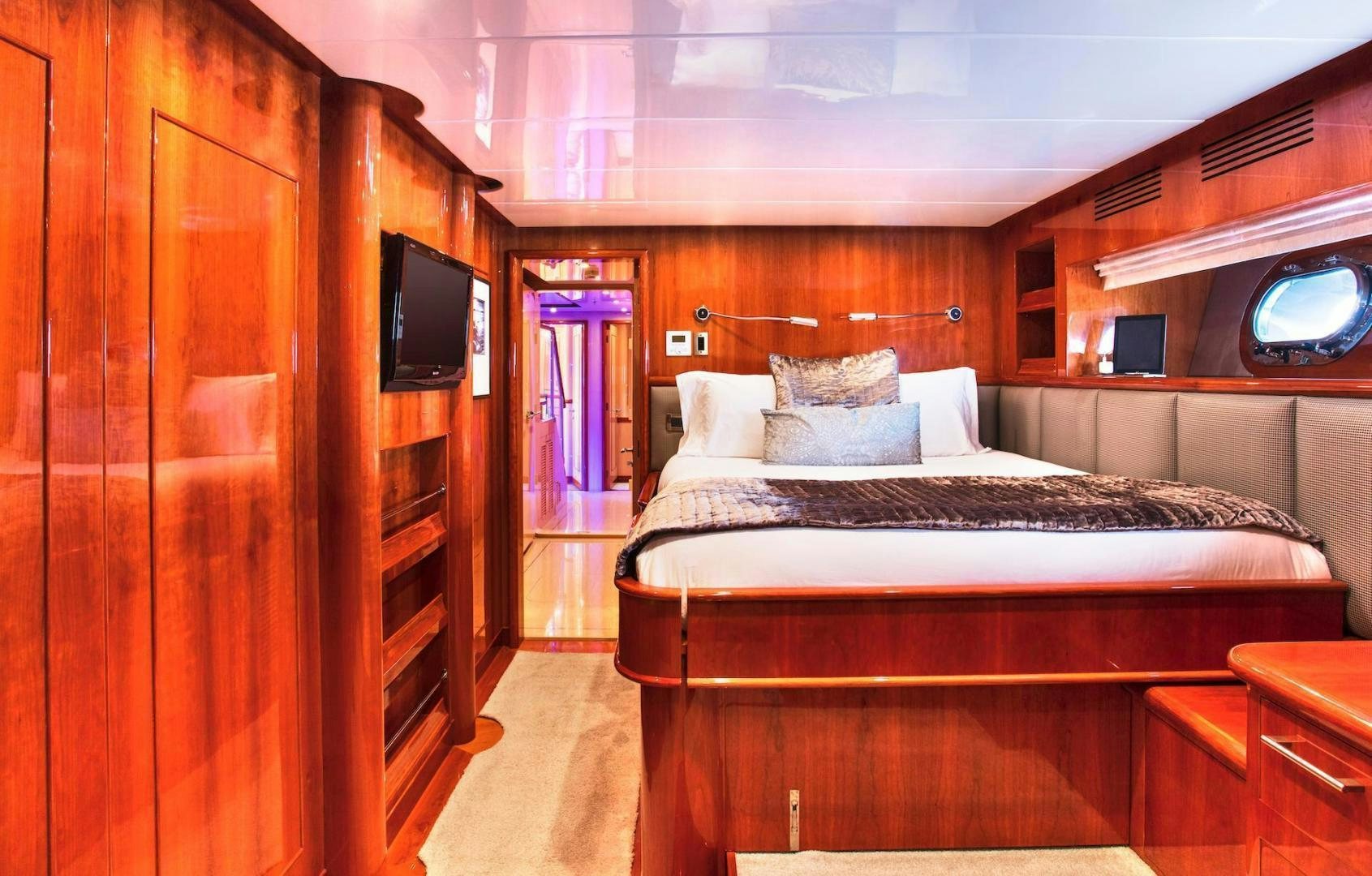 a room with a bed and a television aboard STAY SALTY Yacht for Sale