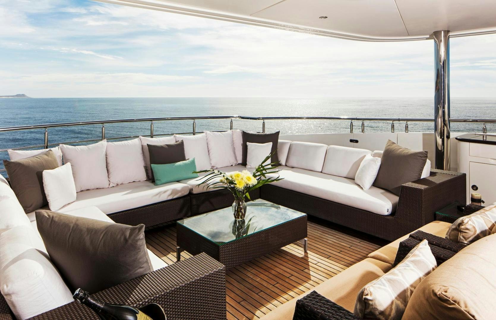 a living room with a large balcony aboard STAY SALTY Yacht for Sale