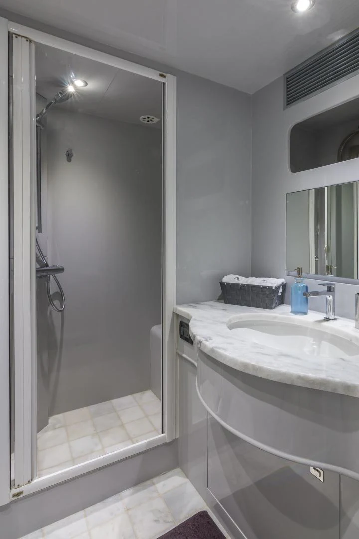 a bathroom with a shower and sink aboard NIRVANA Yacht for Sale